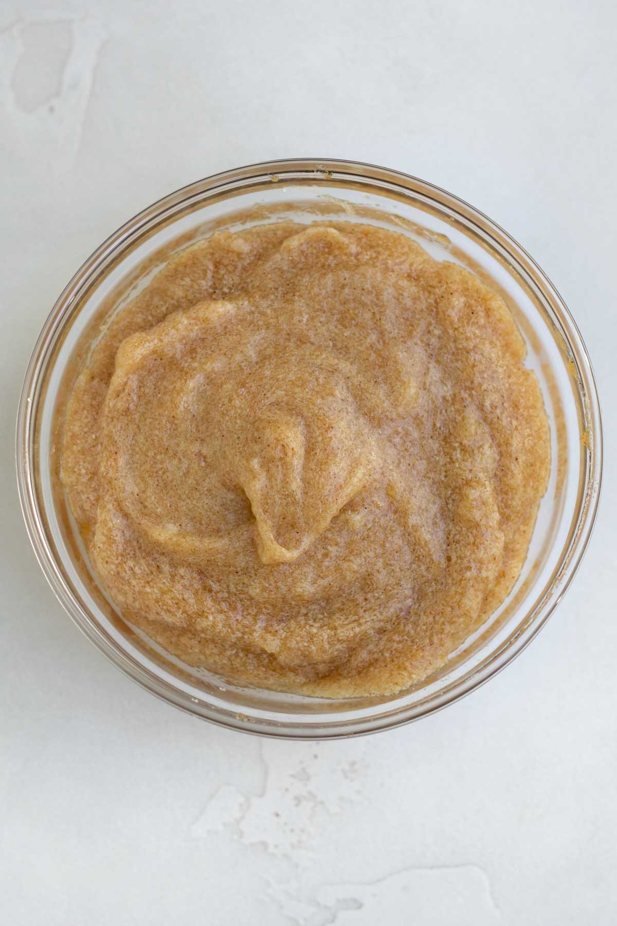 Adding in vanilla and apple butter to the creamed butter.