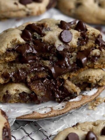 Three halves of Chocolate Filled Cookies oozing delicious warm chocolate goodness.