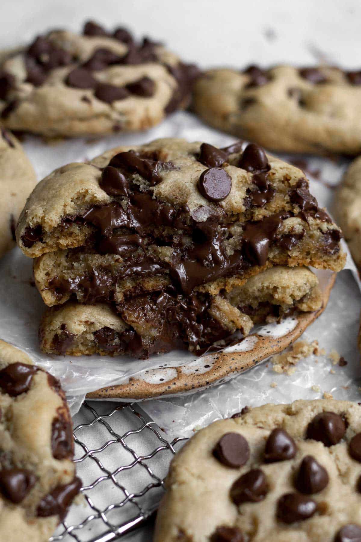 Three halves of Chocolate Filled Cookies oozing delicious warm chocolate goodness.