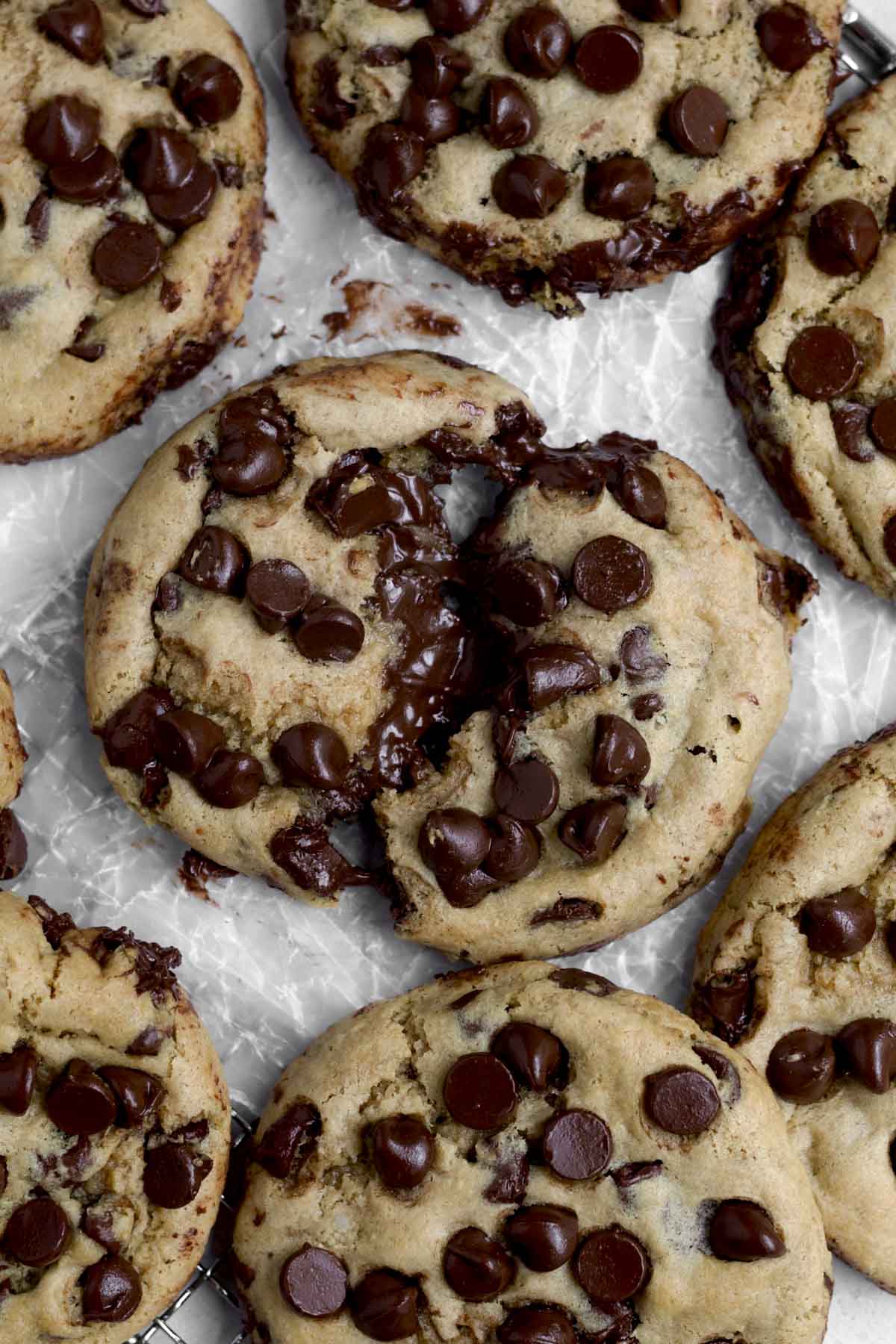 Pulling apart a chocolate filled cookie with gooey sugary chocolate connecting the halves.