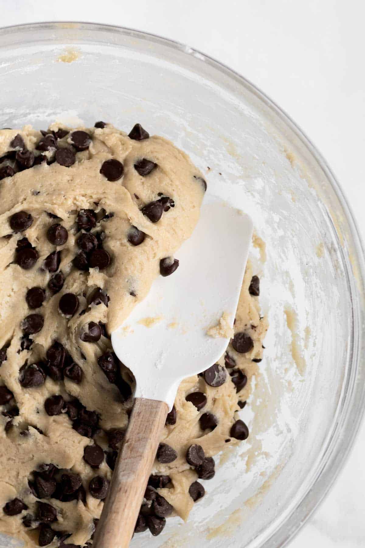 Mixing in hundreds of chocolate chips.
