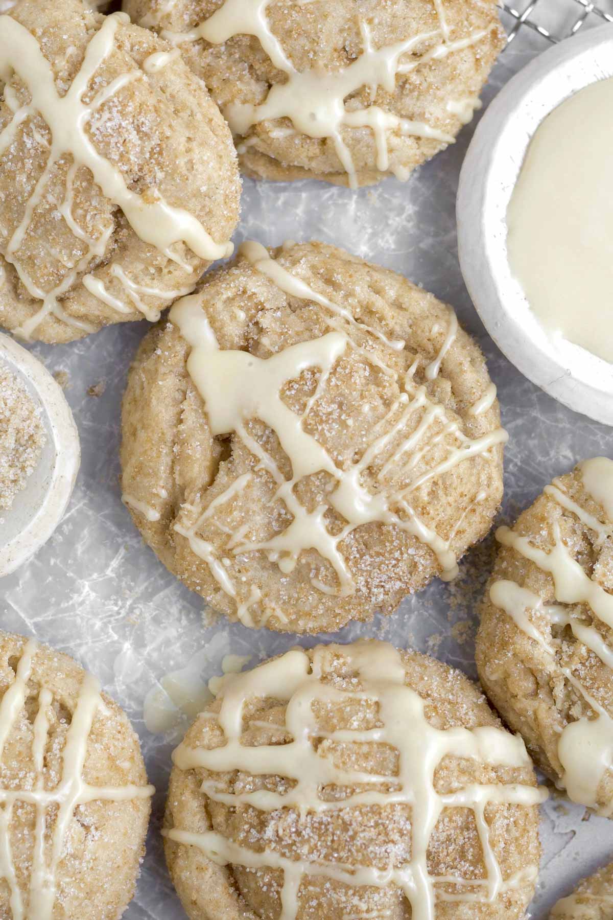 Sugary maple glaze is strewn atop the Brown Sugar Maple Cookies recklessly.