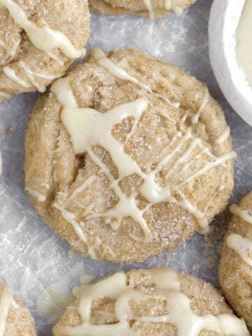 Sugary maple glaze is strewn atop the Brown Sugar Maple Cookies recklessly.