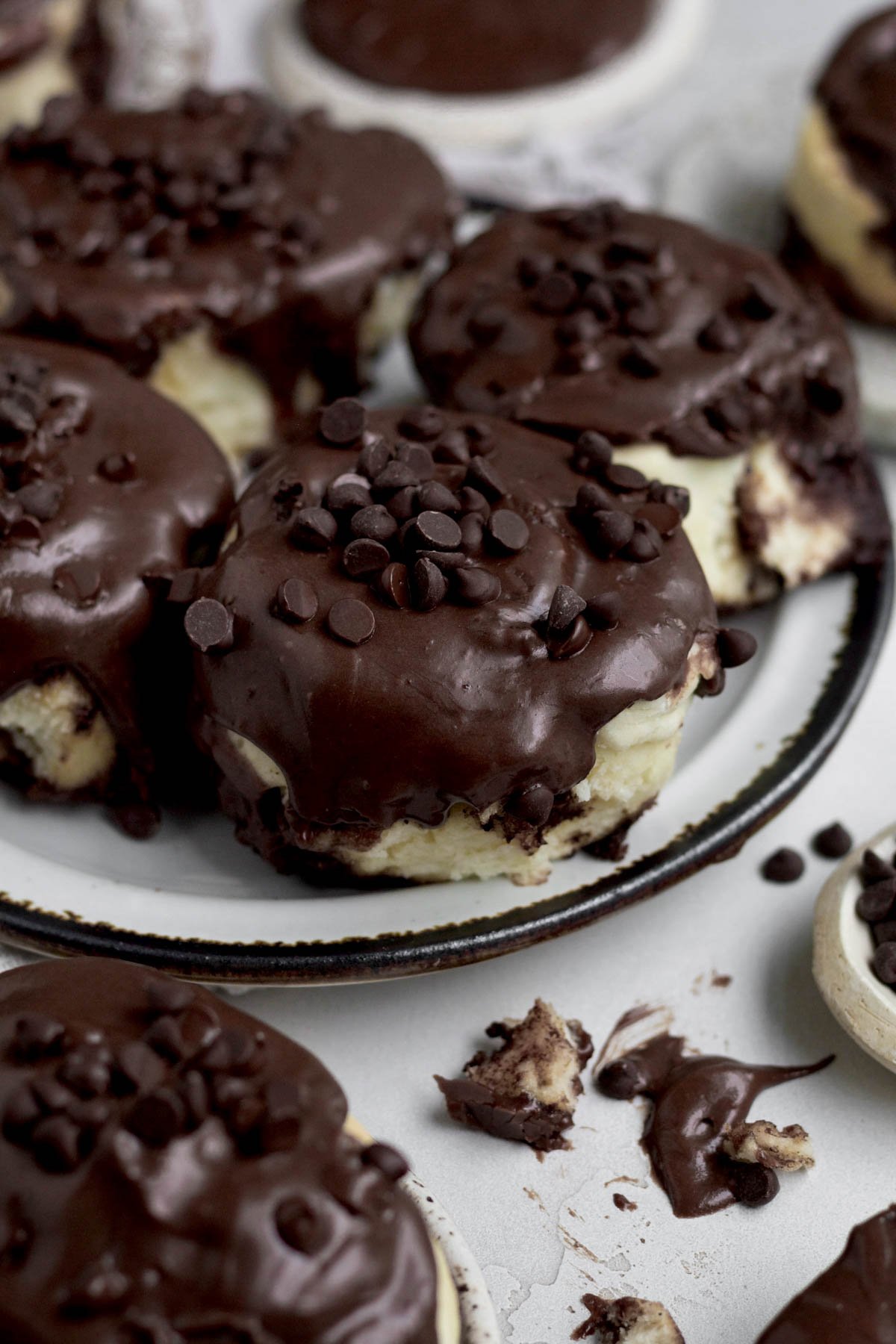 Chocolate and Cinnamon Rolls with a sweet chocolate cream cheese glaze and chocolate chips.