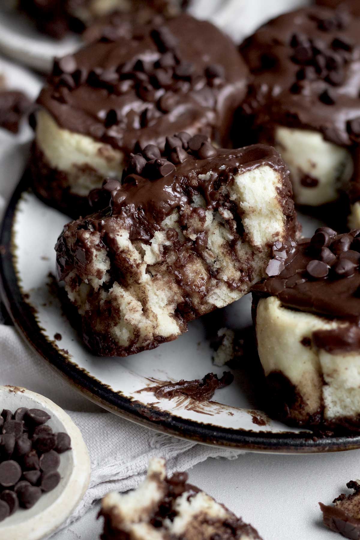 A bite in the Chocolate and Cinnamon Rolls reveals the chocolate cinnamon sugar and dough spiral texture.