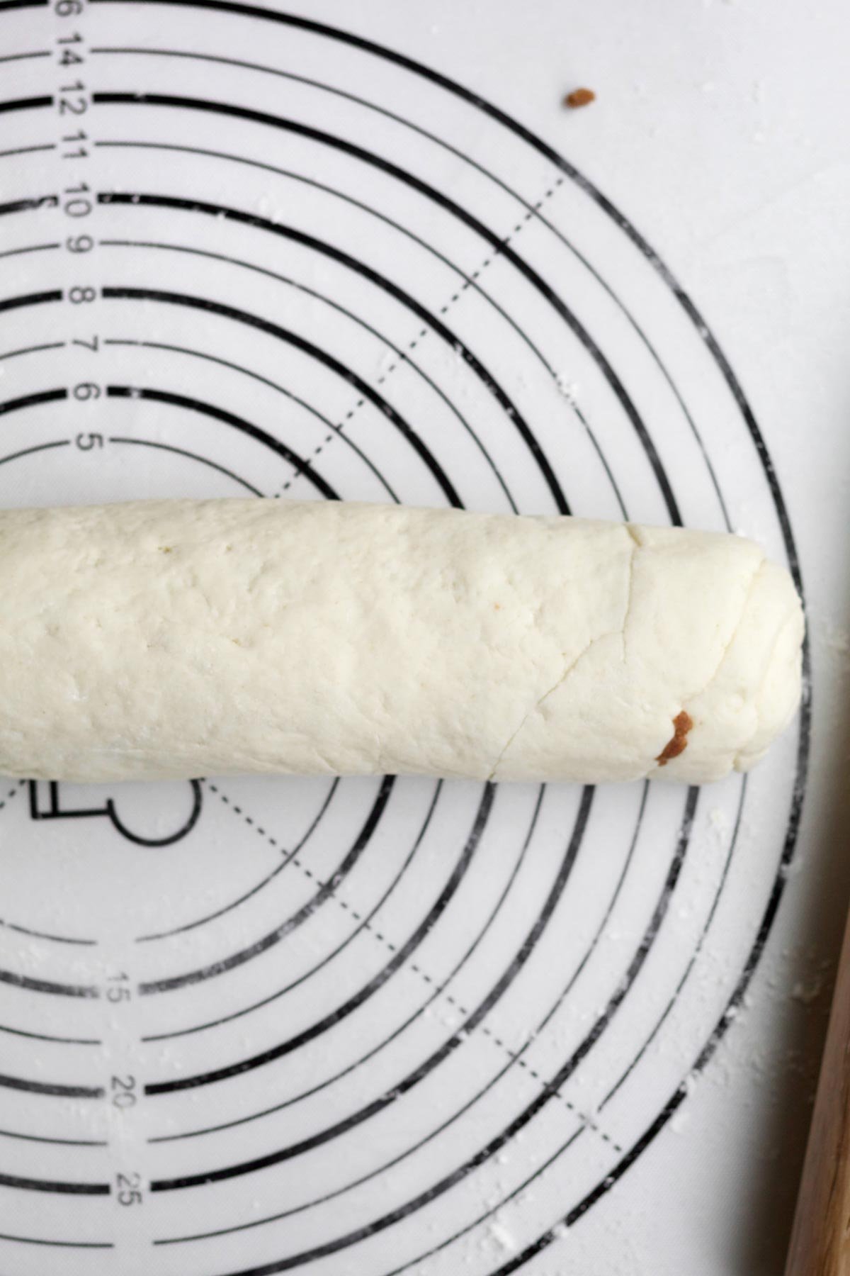 Rolling the dough up.