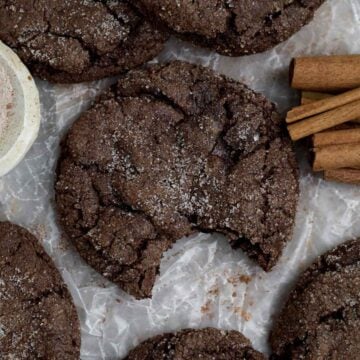 Soft and delicious Chocolate Cinnamon Cookie with a bite missing coated in cinnamon sugar.
