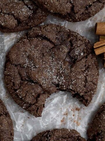 Soft and delicious Chocolate Cinnamon Cookie with a bite missing coated in cinnamon sugar.