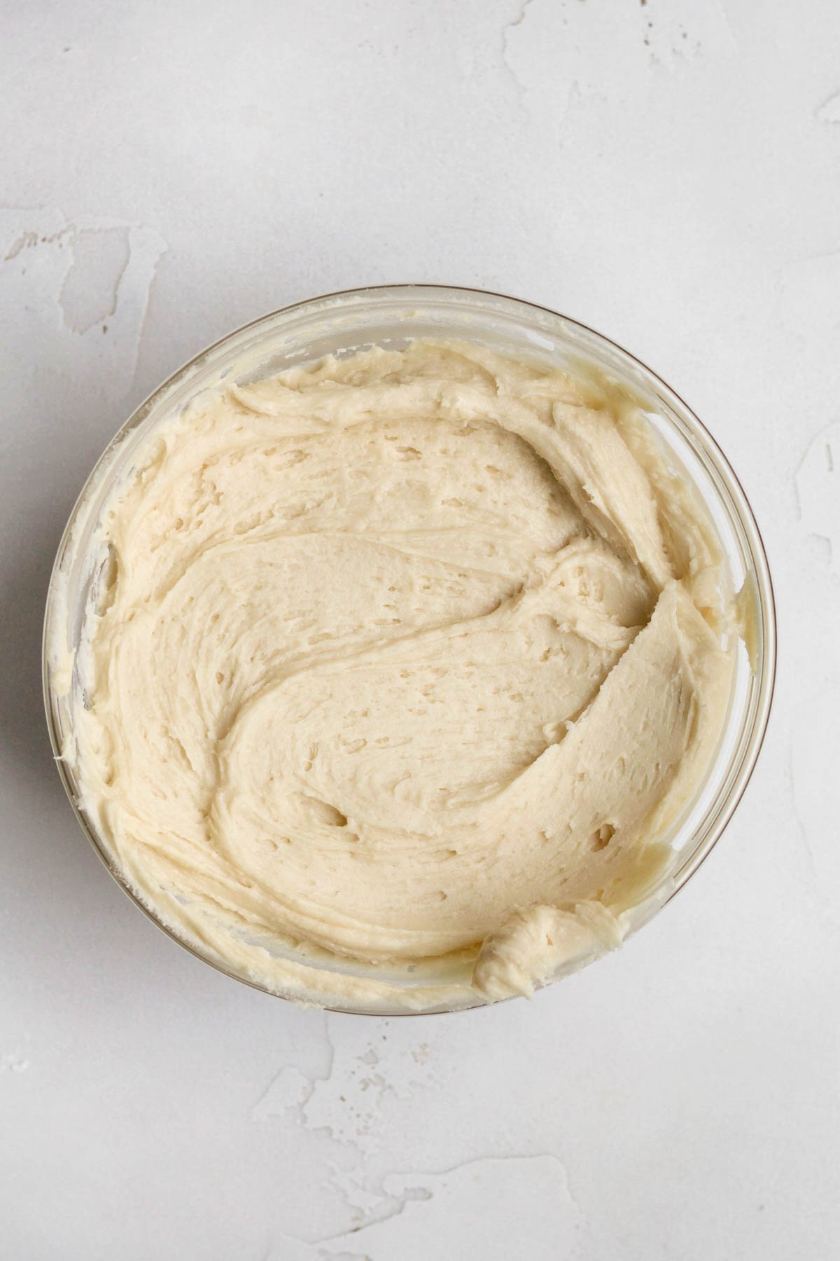 Delicious creamy maple frosting in a bowl.