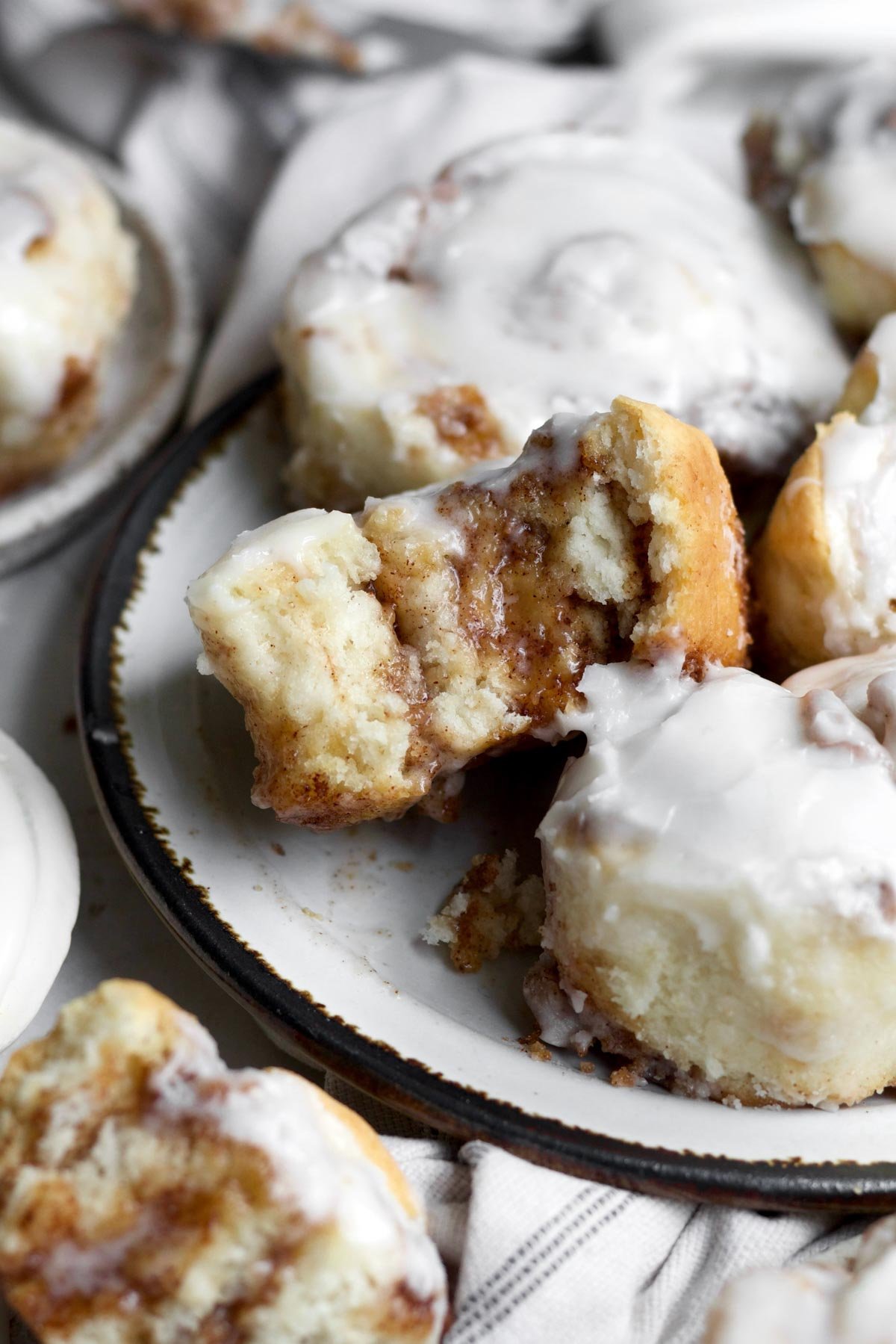 The No yeast Cinnamon rolls topped with glaze reveals the cinnamon sugar and dough spiral texture.
