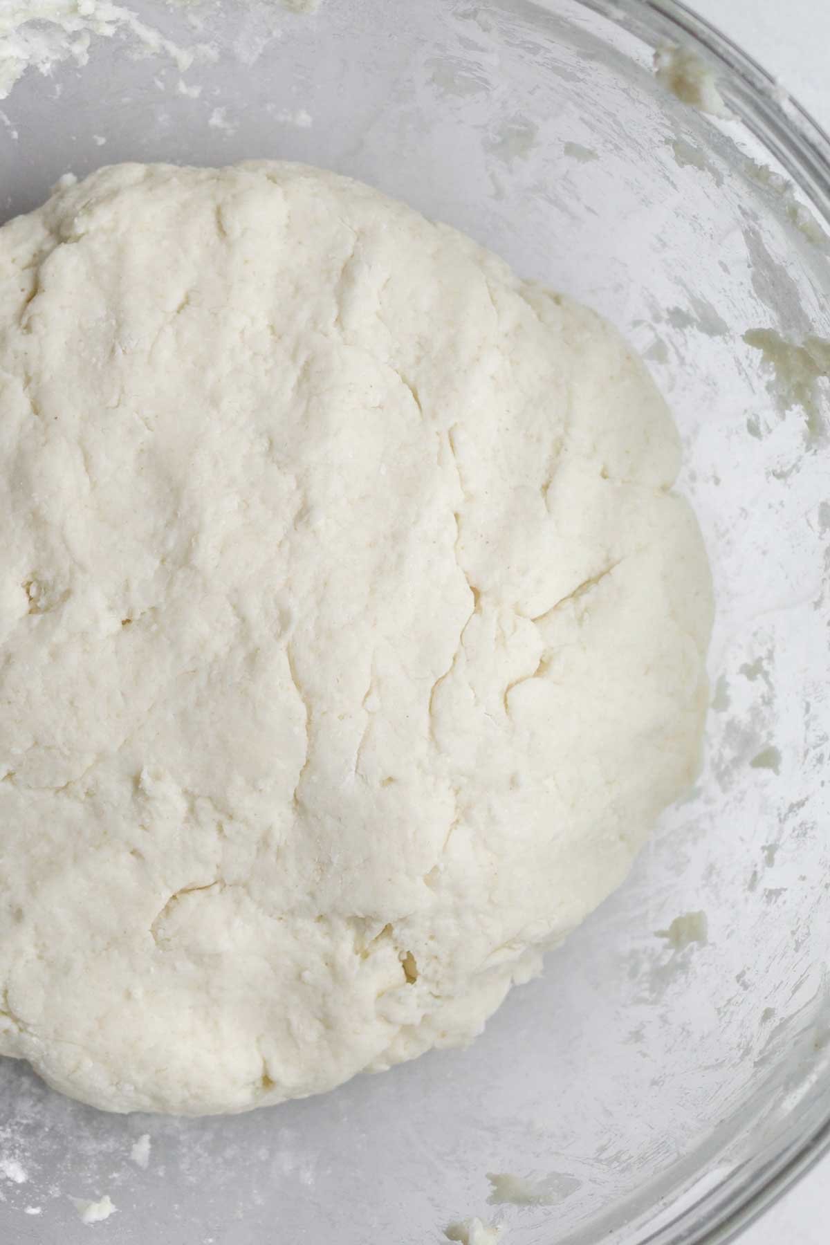 Mixing in the milk for a cinnamon roll batter.