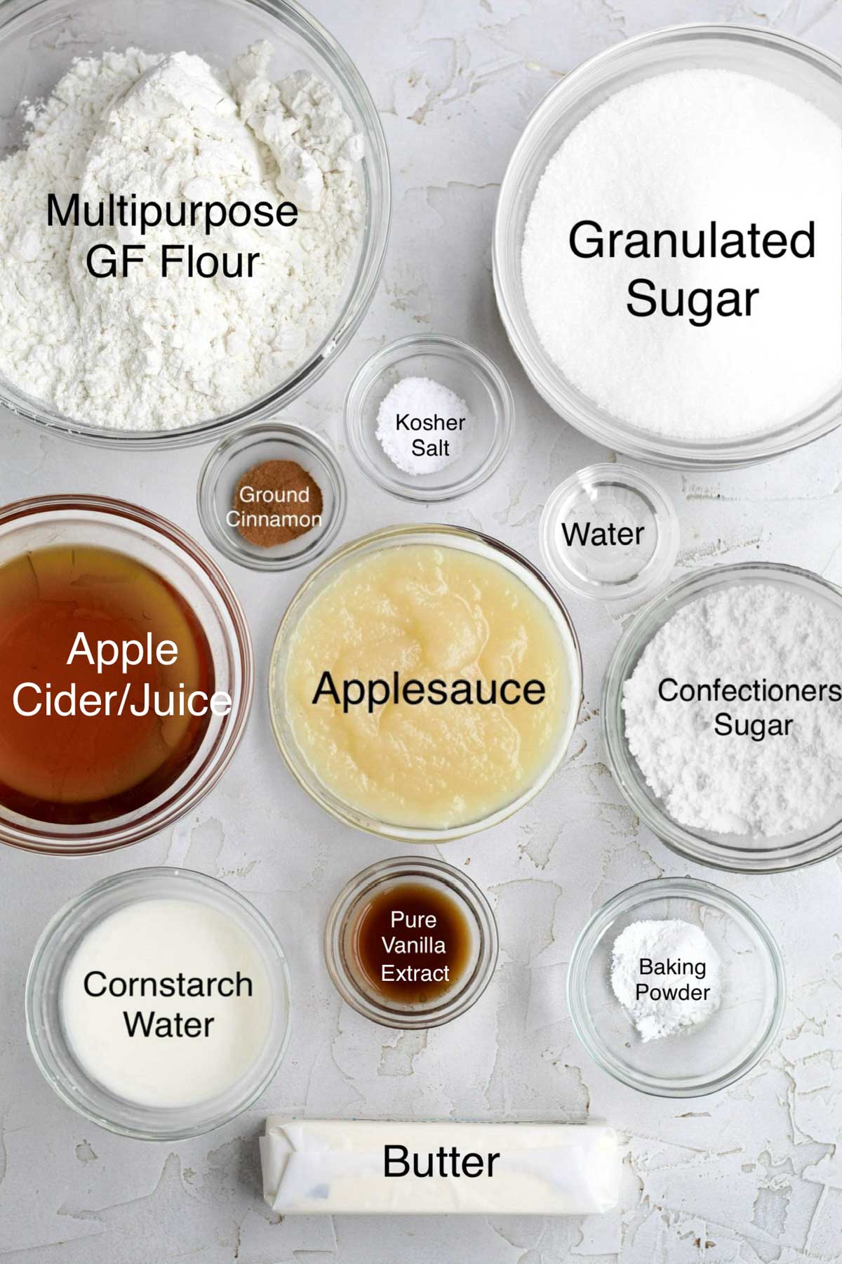 Multipurpose gluten free flour, granulated sugar, apple cider/juice, ground cinnamon, kosher salt, water, applesauce, confectioners' sugar, cornstarch water, pure vanilla extract, baking powder and butter in separate containers.
