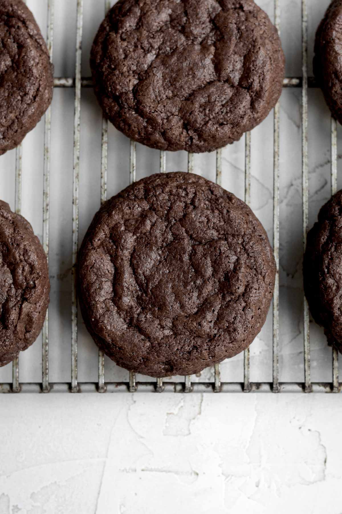 Fresh Fudgy Brownie Cookies resting on a baking rack.
