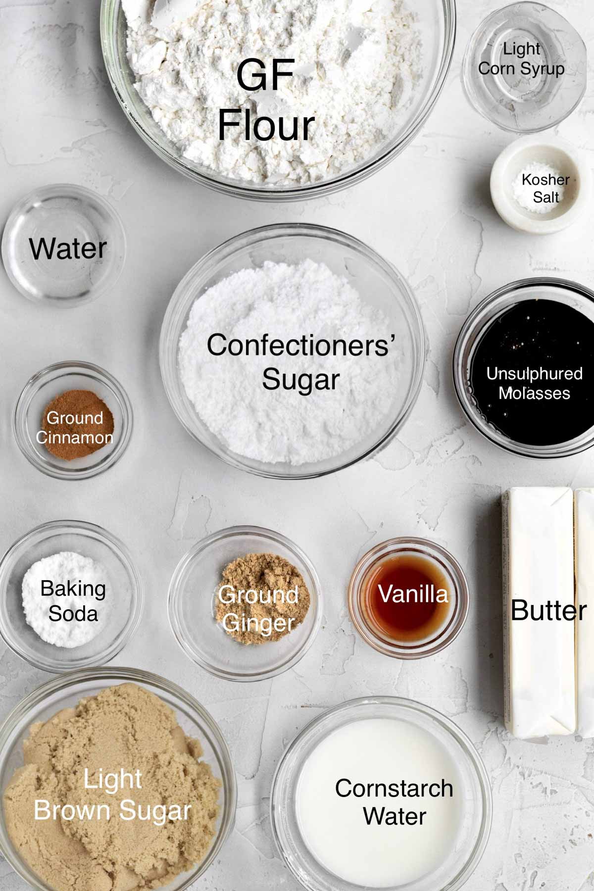 Gluten Free flour, light corn syrup, kosher salt, water, confectioners' sugar, unsulphured molasses, ground cinnamon, baking soda, ground ginger, vanilla, butter, light brown sugar, and cornstarch water in separate containers.