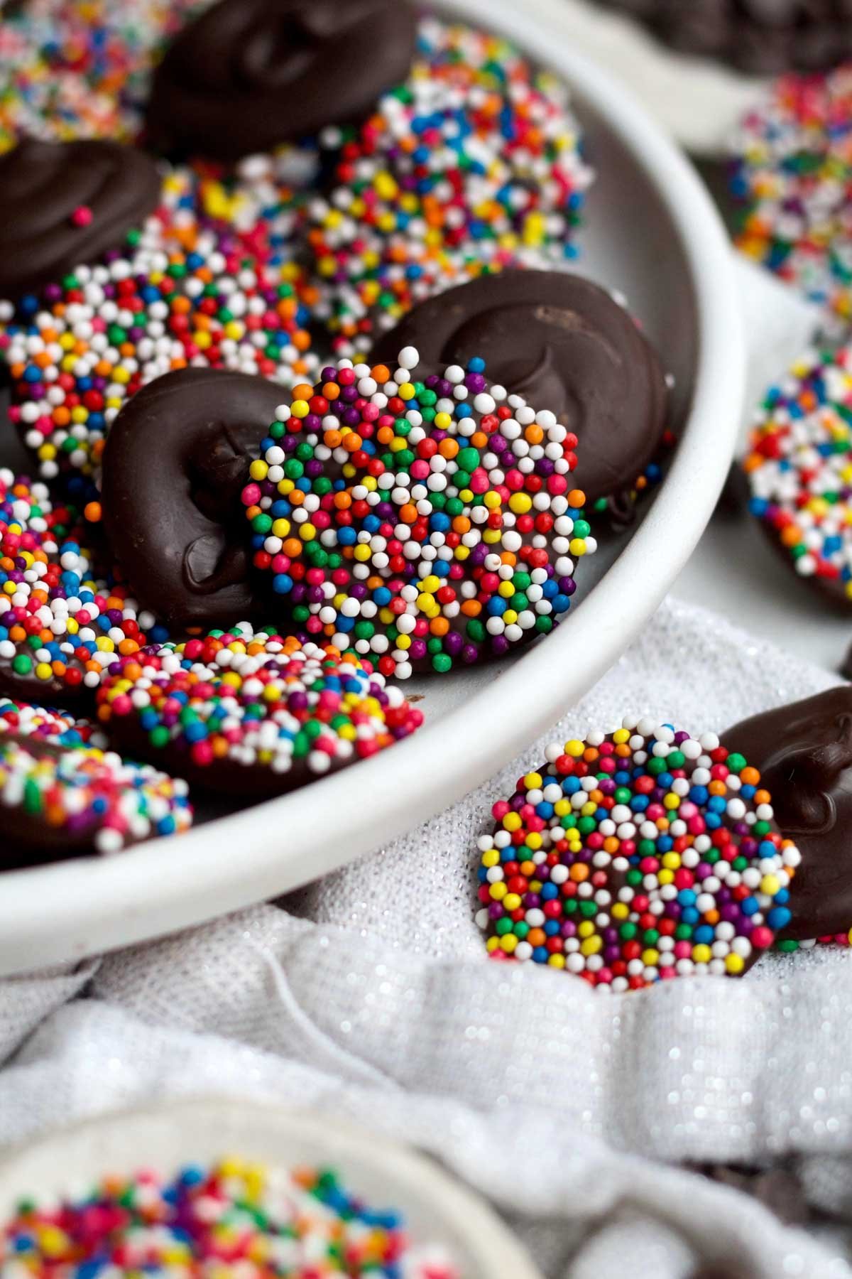 A plate of bite-sized sugary Chocolate Nonpareils.