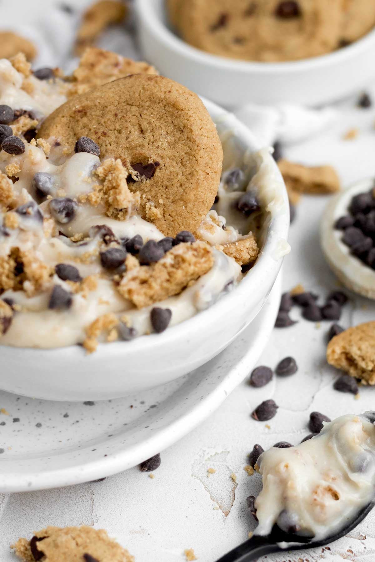 A soft cookie dives into edible cookie dough dip.