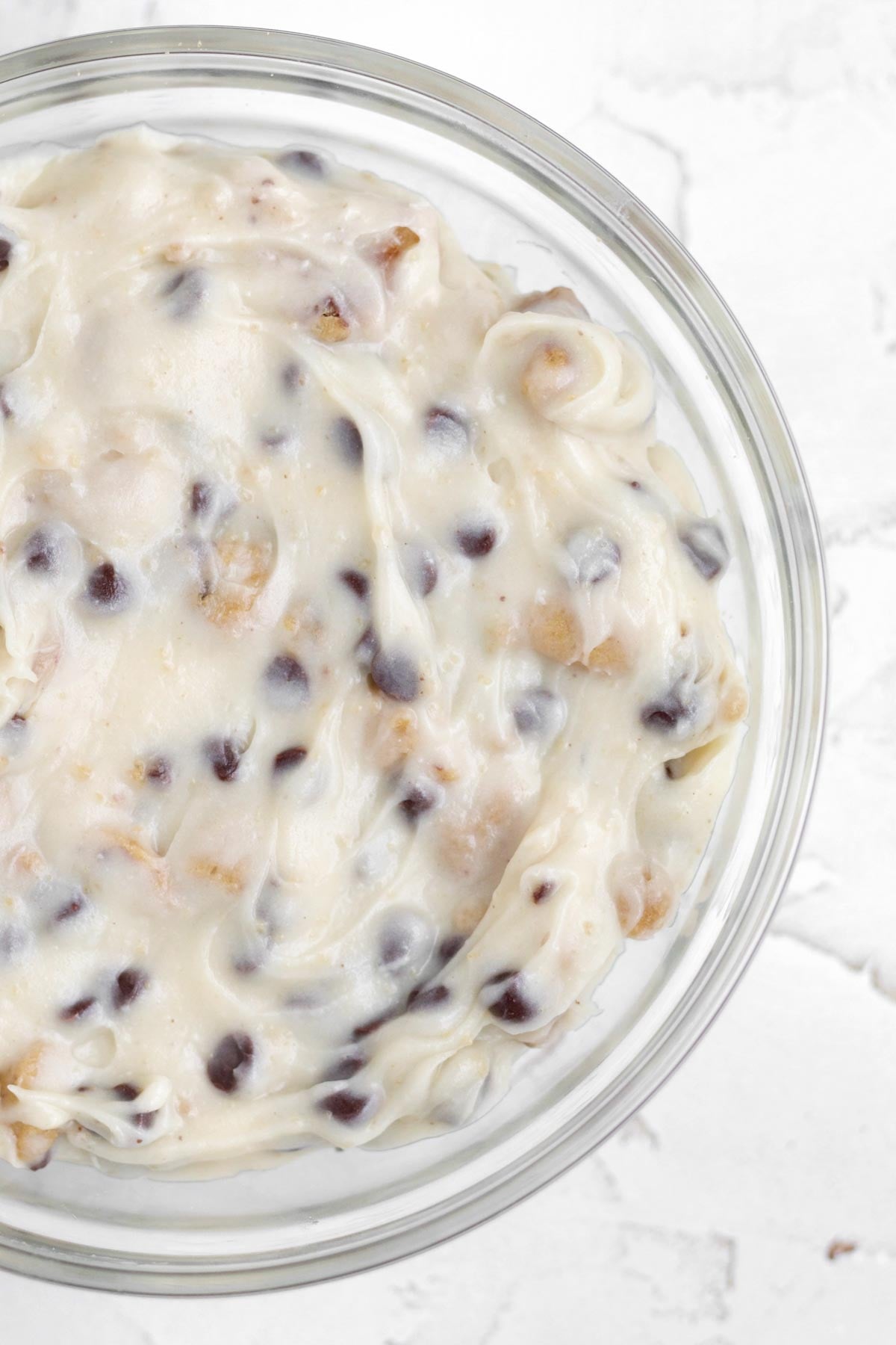 Cream cheese dip infused with broken chocolate chip cookies and extra chips.