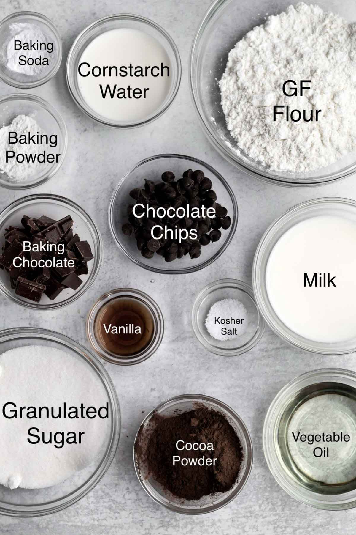 Triple chocolate muffins ingredients: baking soda, cornstarch water, gluten free flour, baking powder, baking chocolate, chocolate chips, vanilla, kosher salt, milk, granulated sugar, cocoa powder, and vegetable oil.