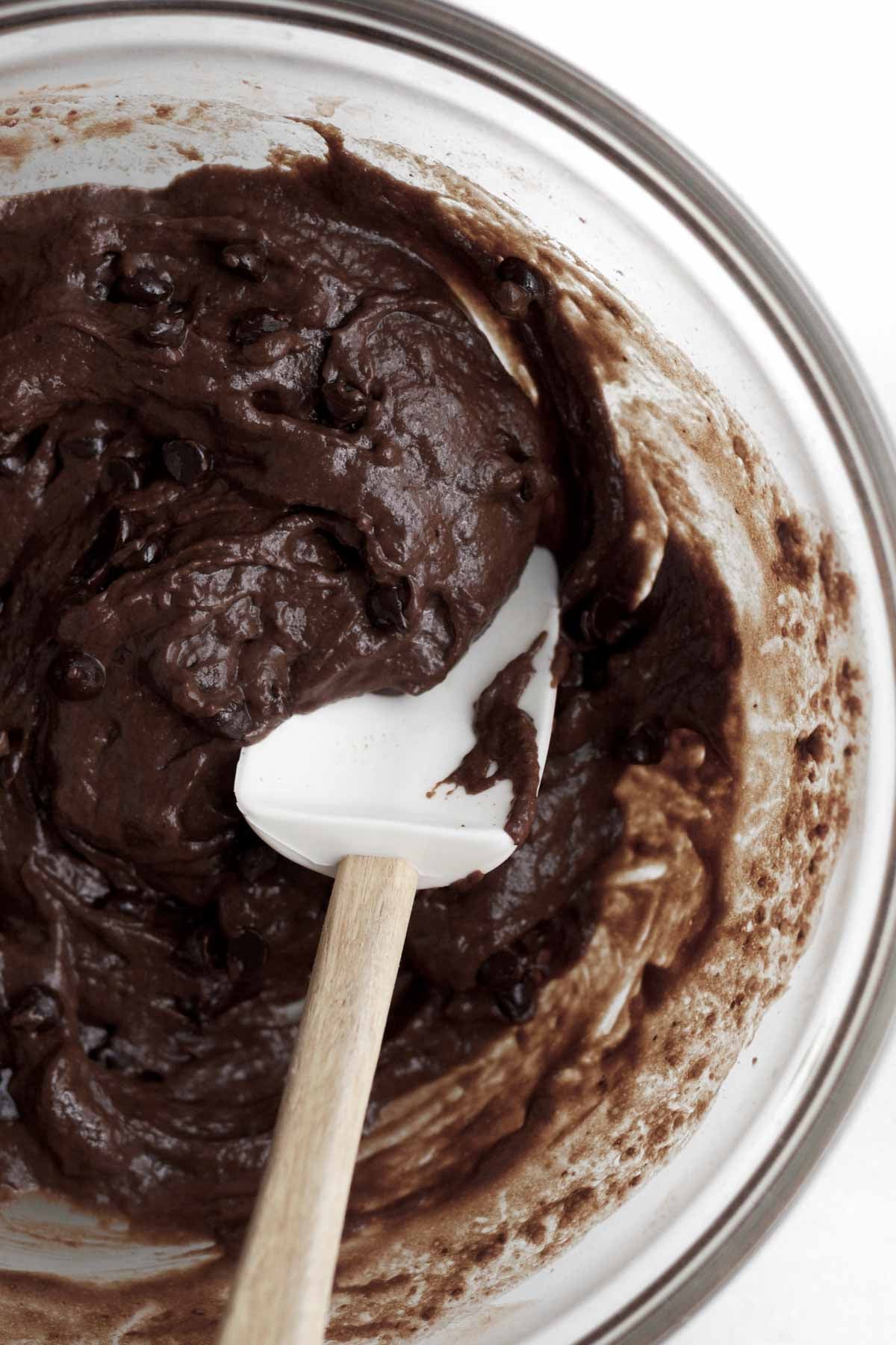 mixing in the wet ingredients and semi-sweet chocolate mini chips.