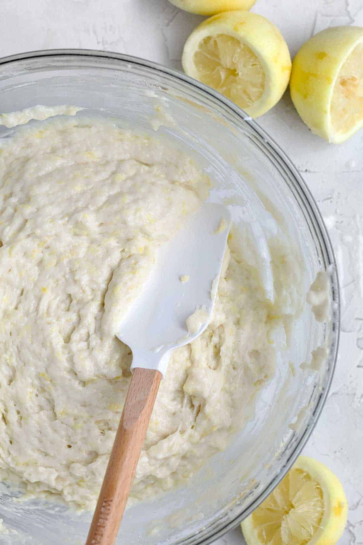 mixing the wet and dry ingredients into a loaf batter.