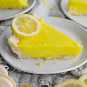 a perfect, tart, eggless lemon curd pie slice with golden sandwich cookie crust.