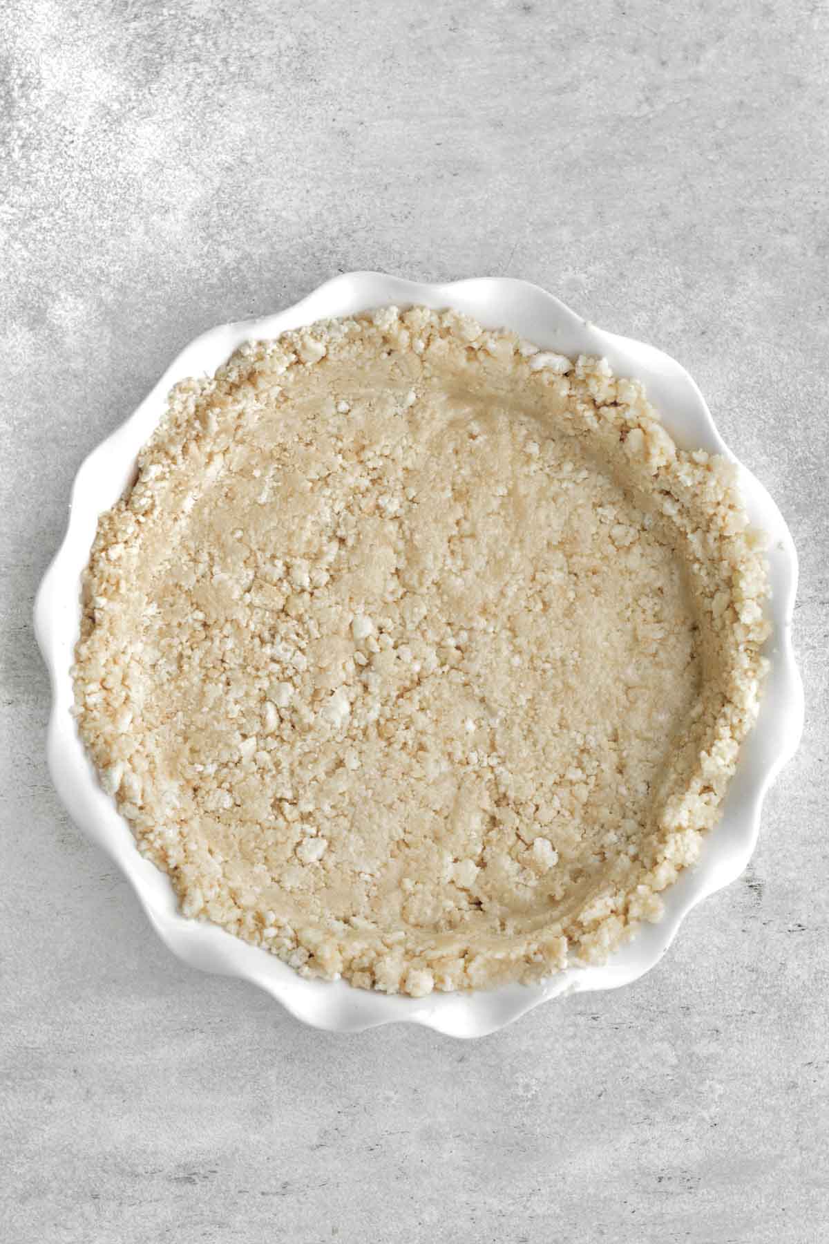 vanilla cookie crust pressed into a ruffles white pie dish.