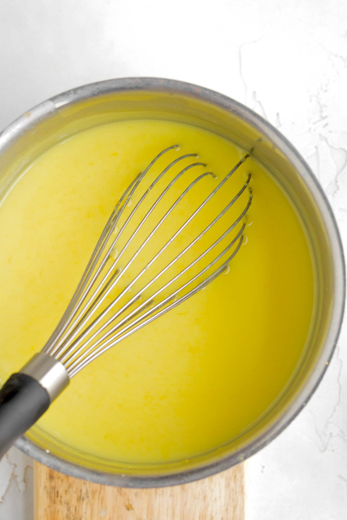 mixing in the butter into the boiling mix.