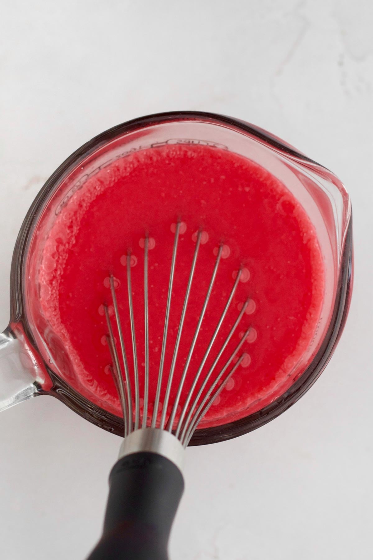 whisking up the red wet ingredients.