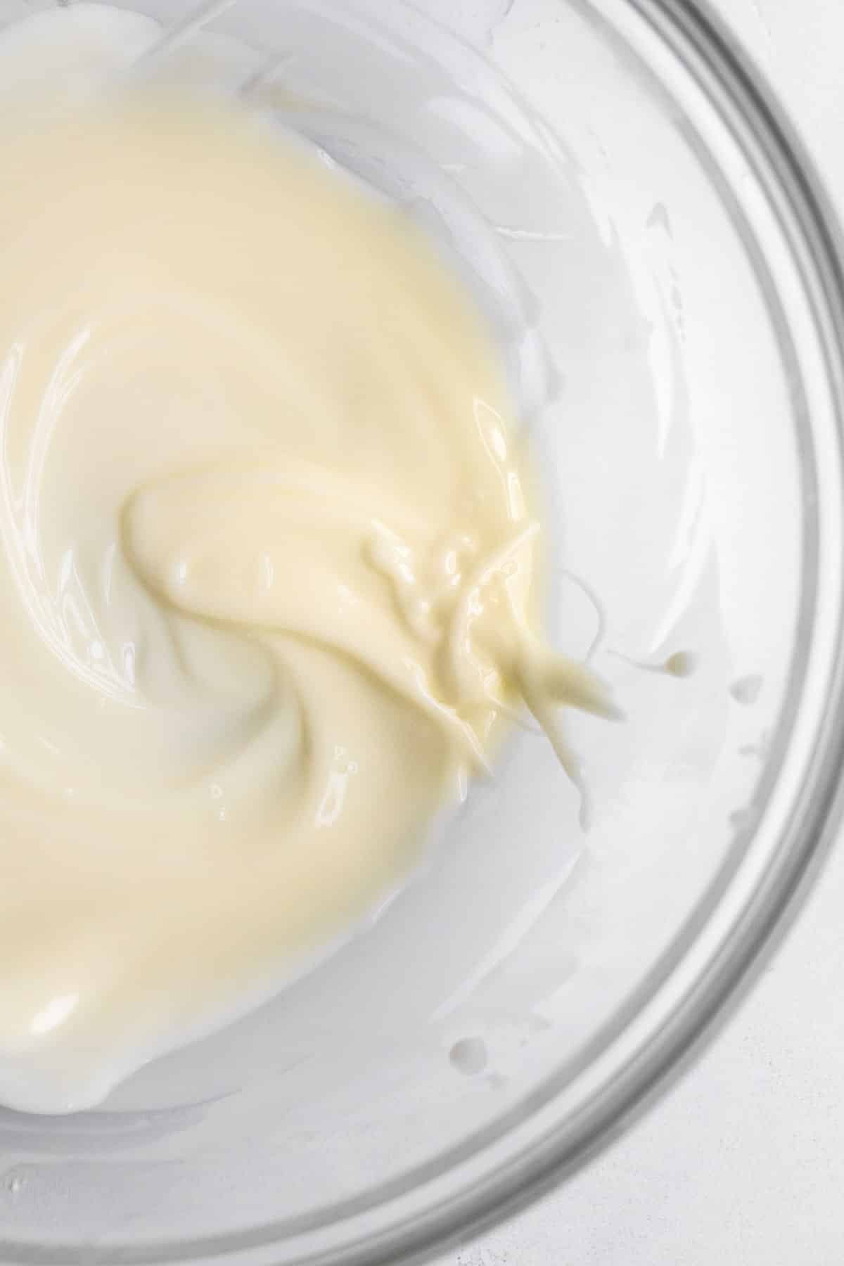 warm melted butter, stirred in a bowl.