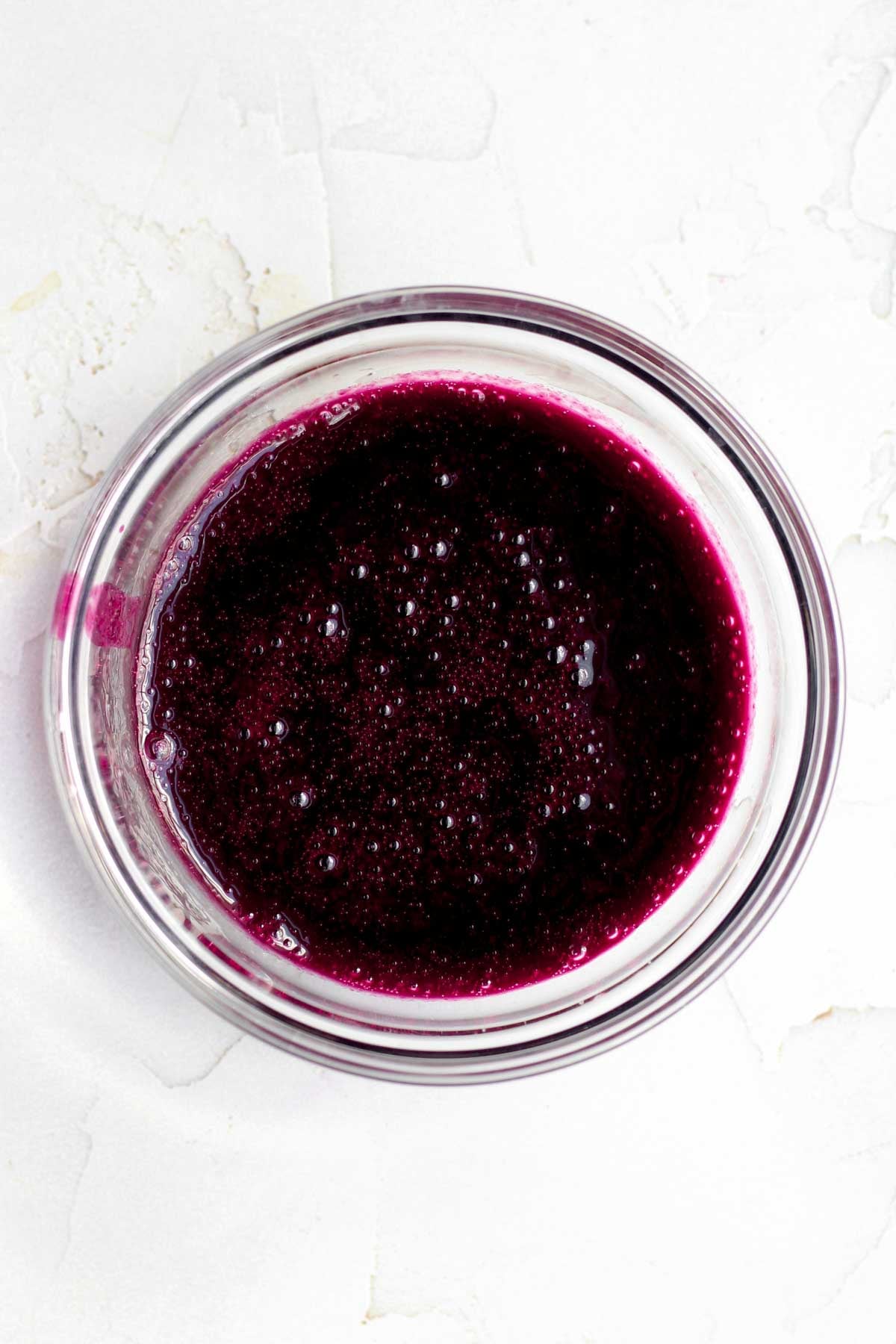 warm, magenta jammy blueberry liquid in a bowl.