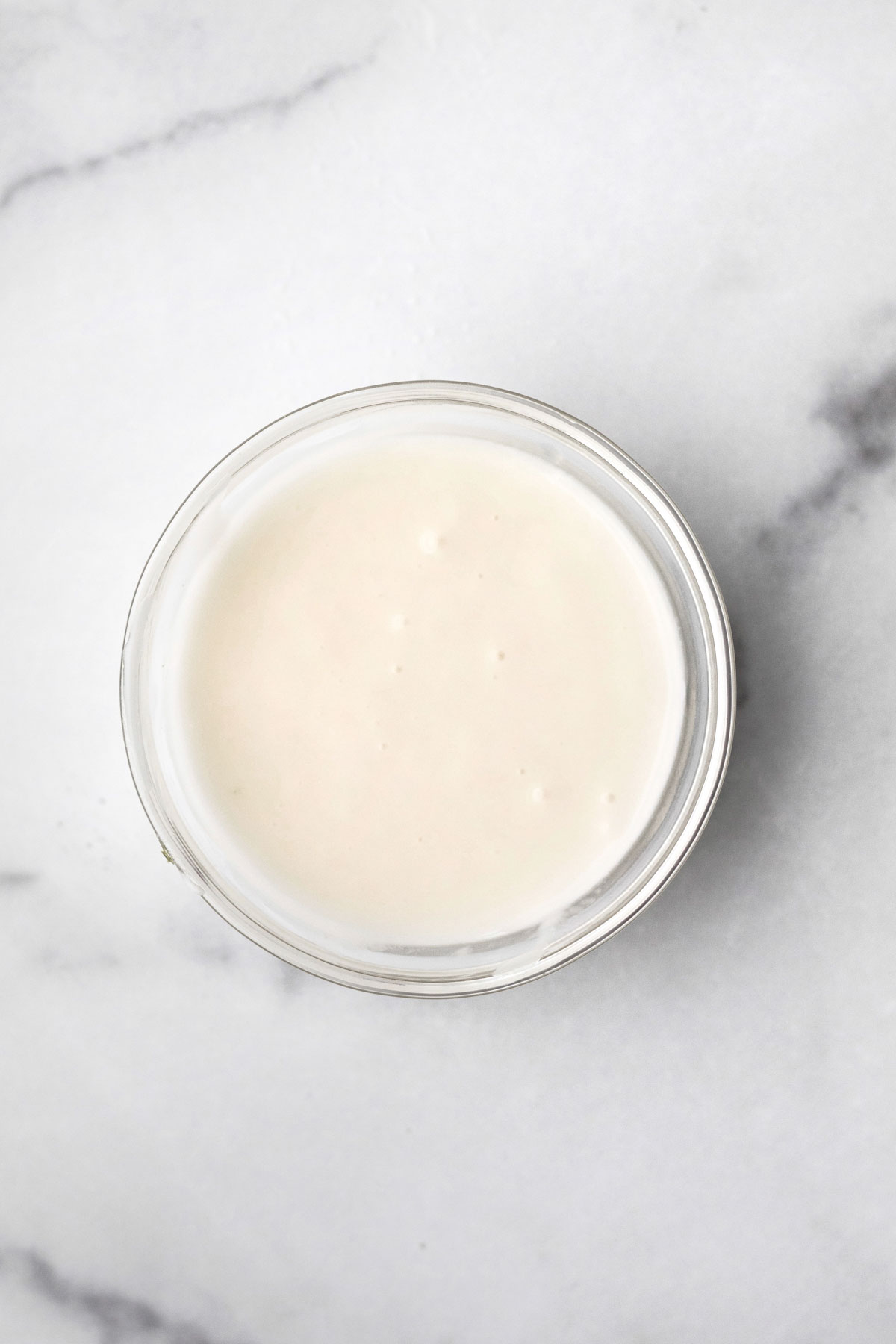 sugary vanilla icing in a bowl.