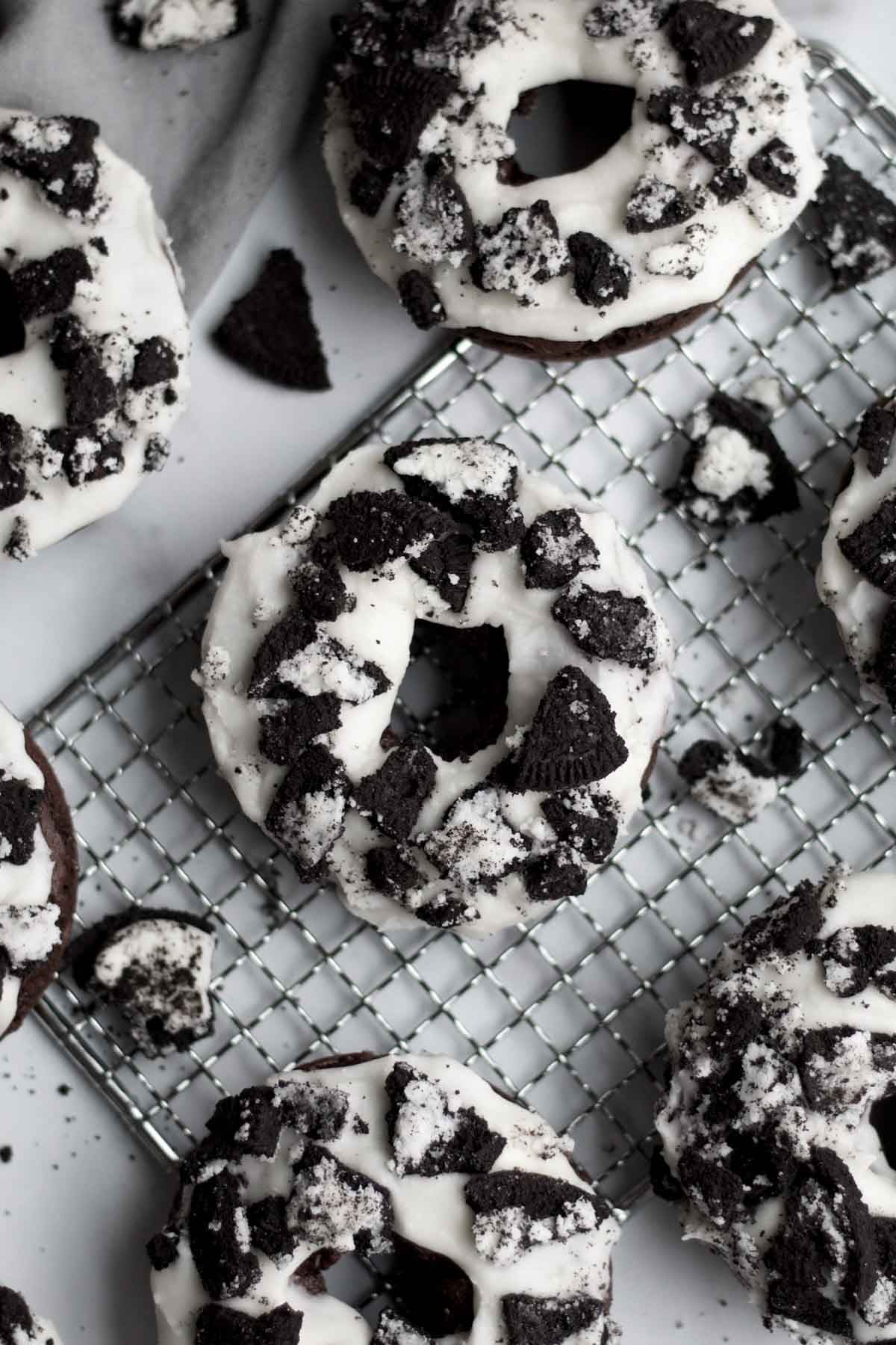 delicious, baked, cookies and cream donuts topped with crunchy broken chocolate sandwich cookies.