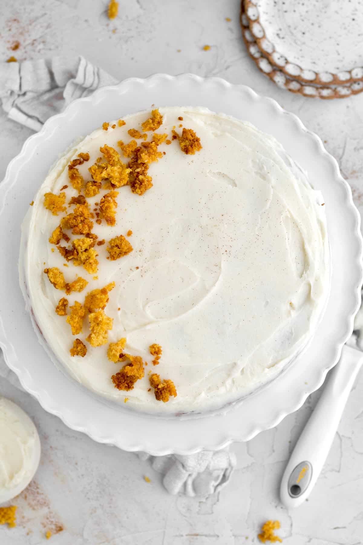 whole, gluten-free, easy carrot cake topped with velvety cream cheese frosting and golden cake crumbs.