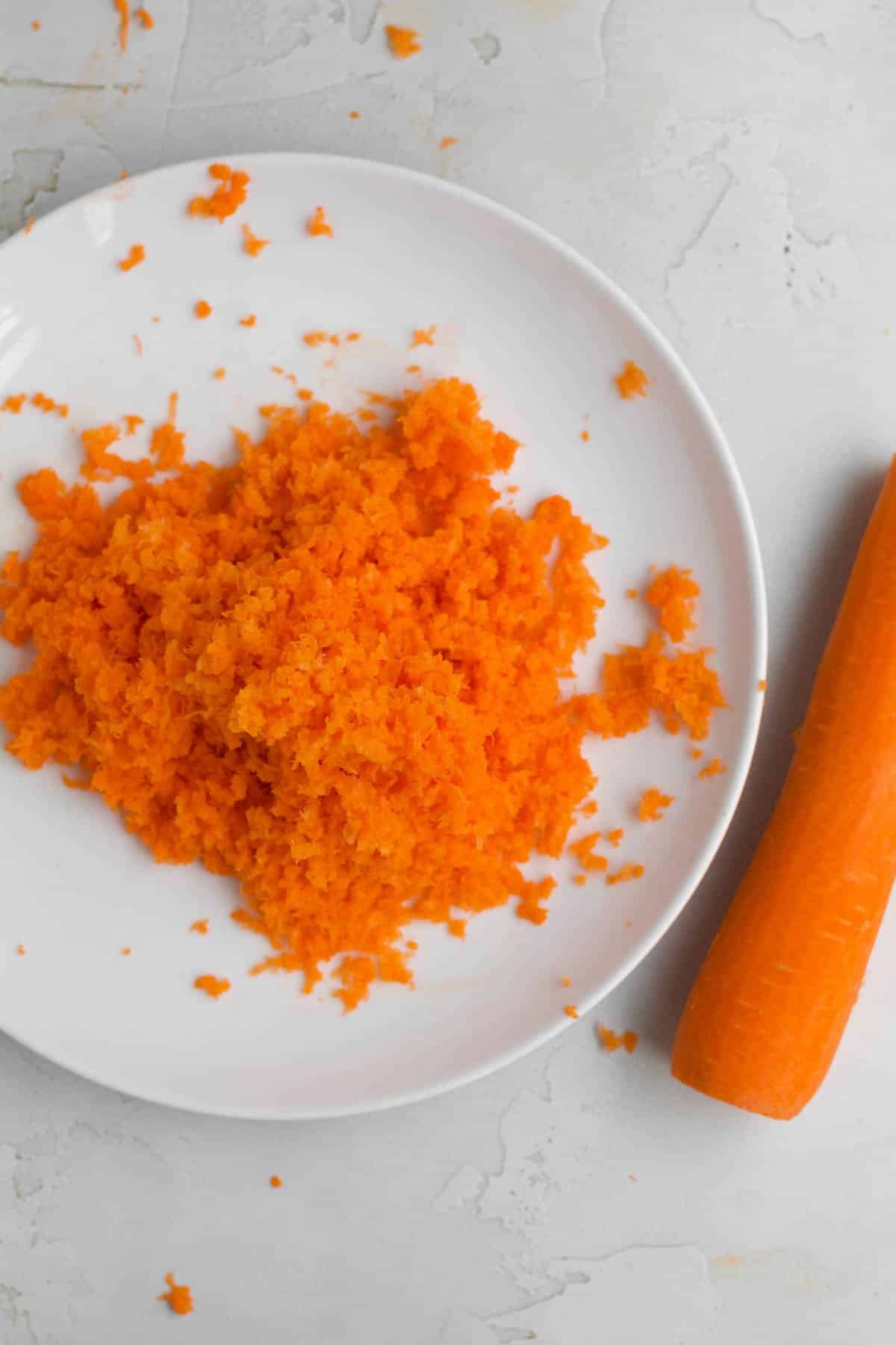 bright orange carrot zest on a plate.