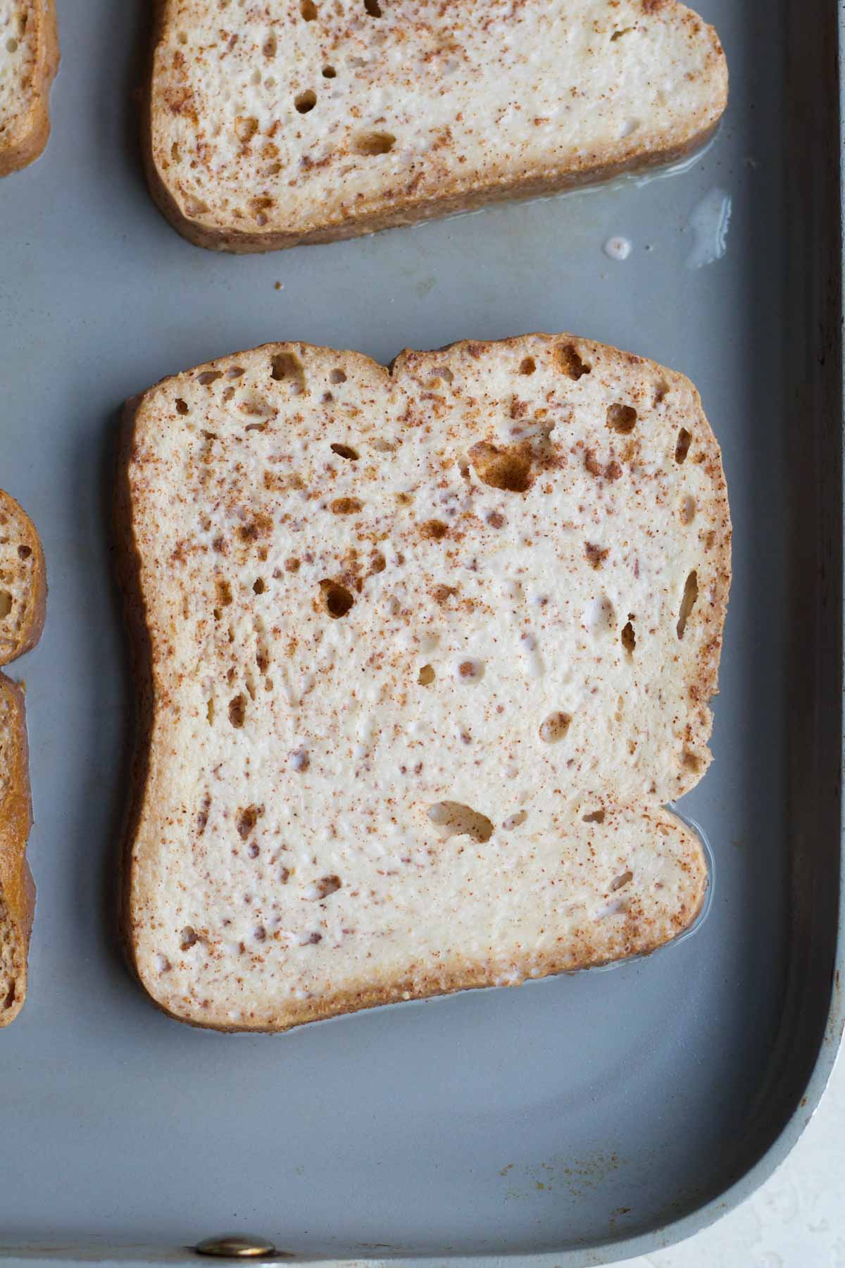 putting the soaked slices on a hot nonstick pan.