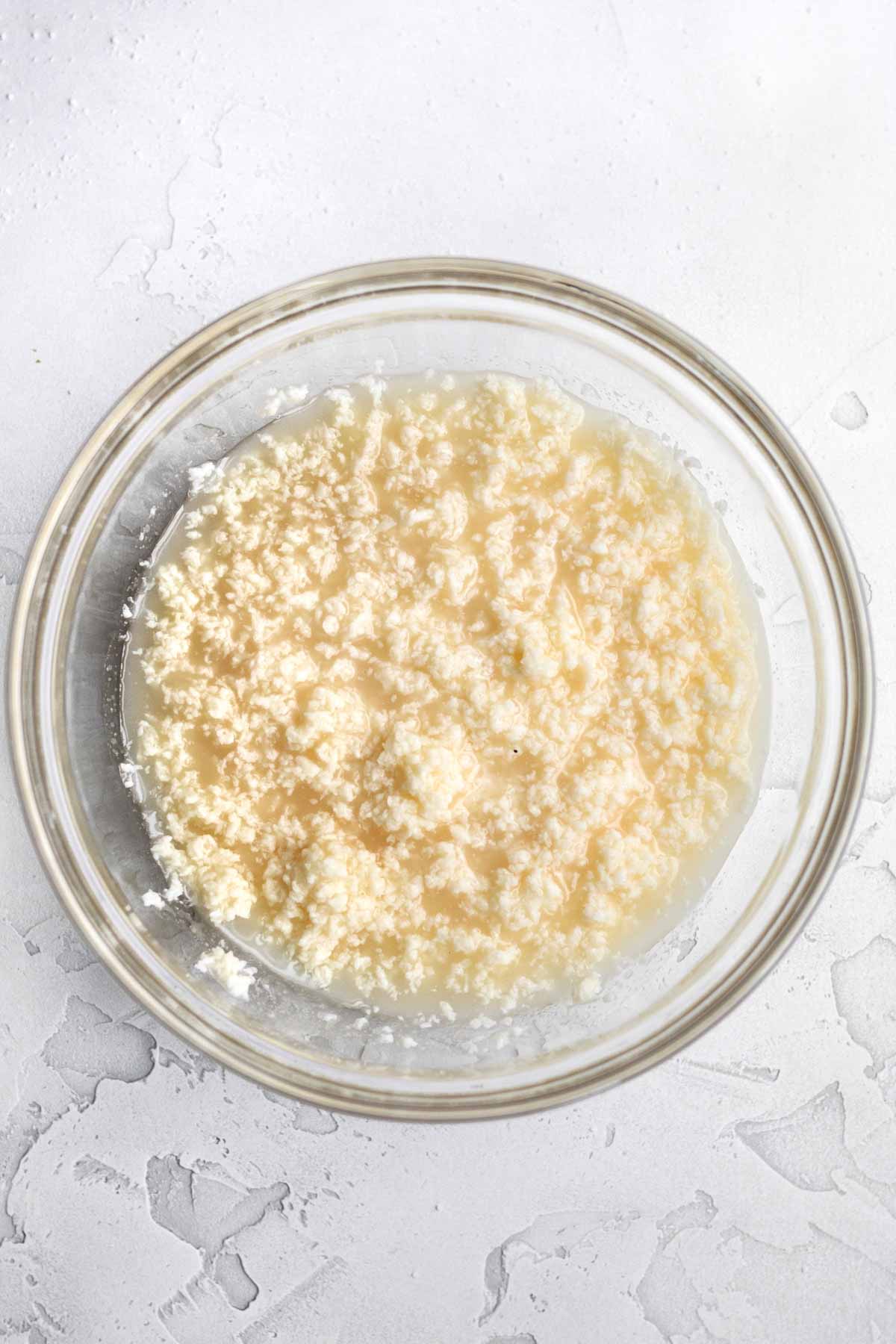 mixing the wet ingredients into the creamed butter.
