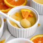 velvety orange posset with a creamy, sweet, perfect spoonful scooped out.