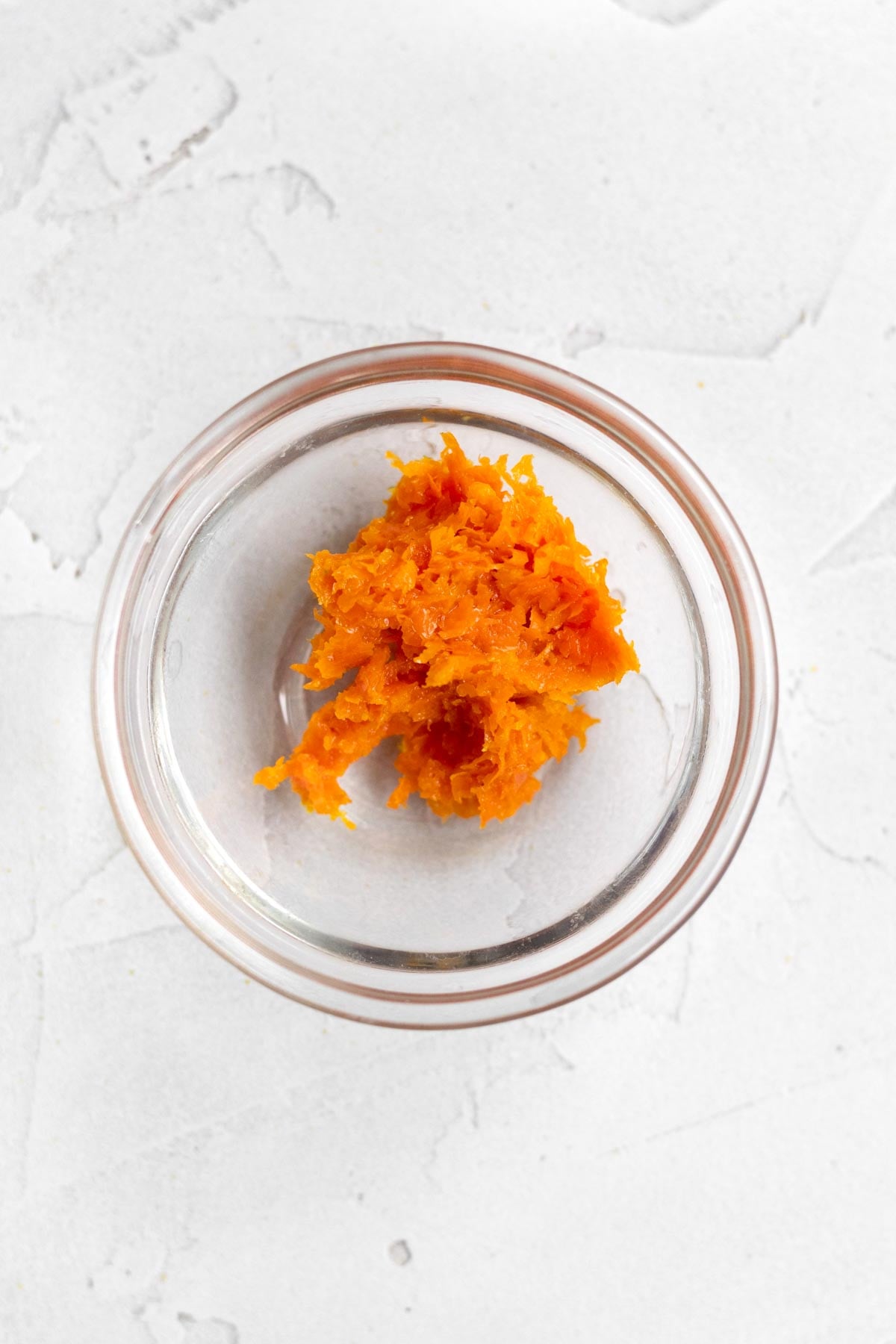 bright flecks of orange zest in a bowl.