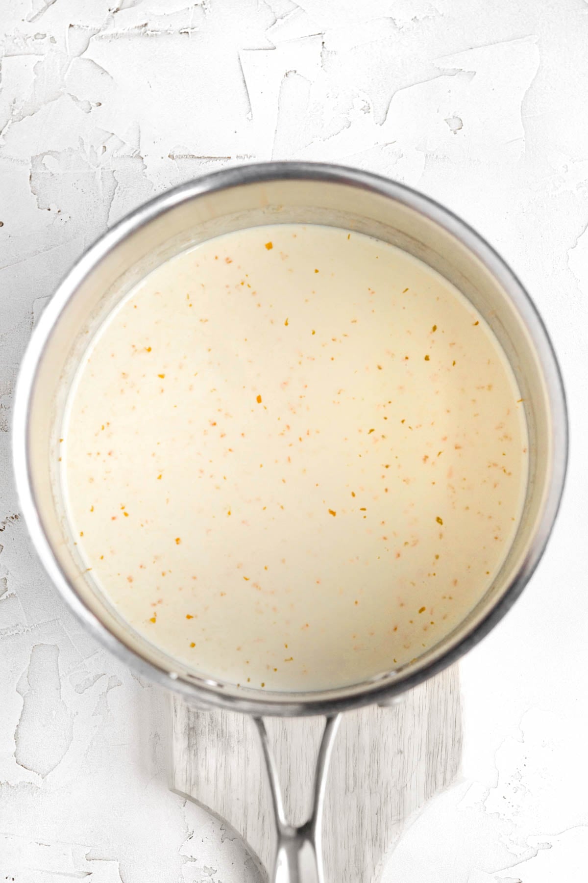 a saucepan with the heavy cream, zest and sugars mixed together.