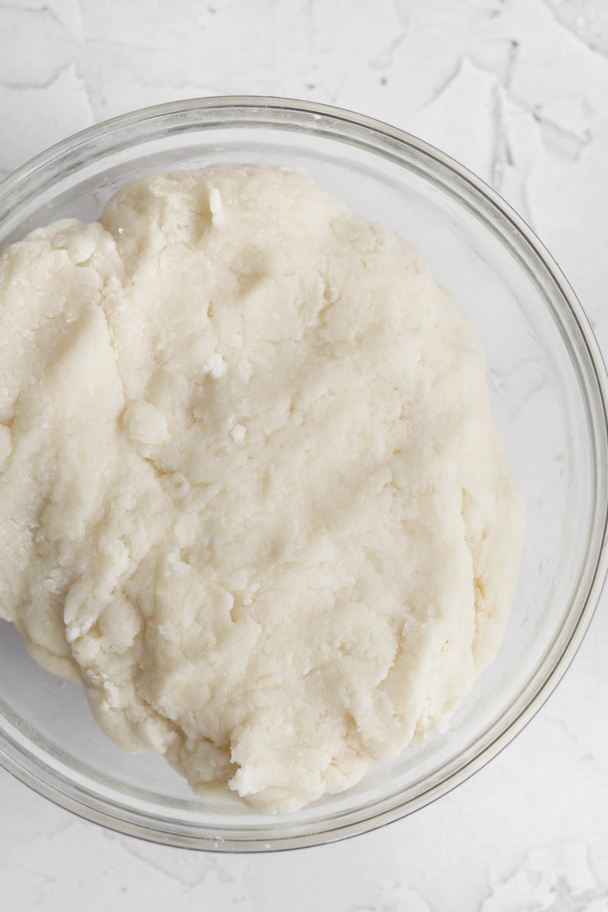 mixing the wet and dry ingredients into a cheesecake cookie batter.