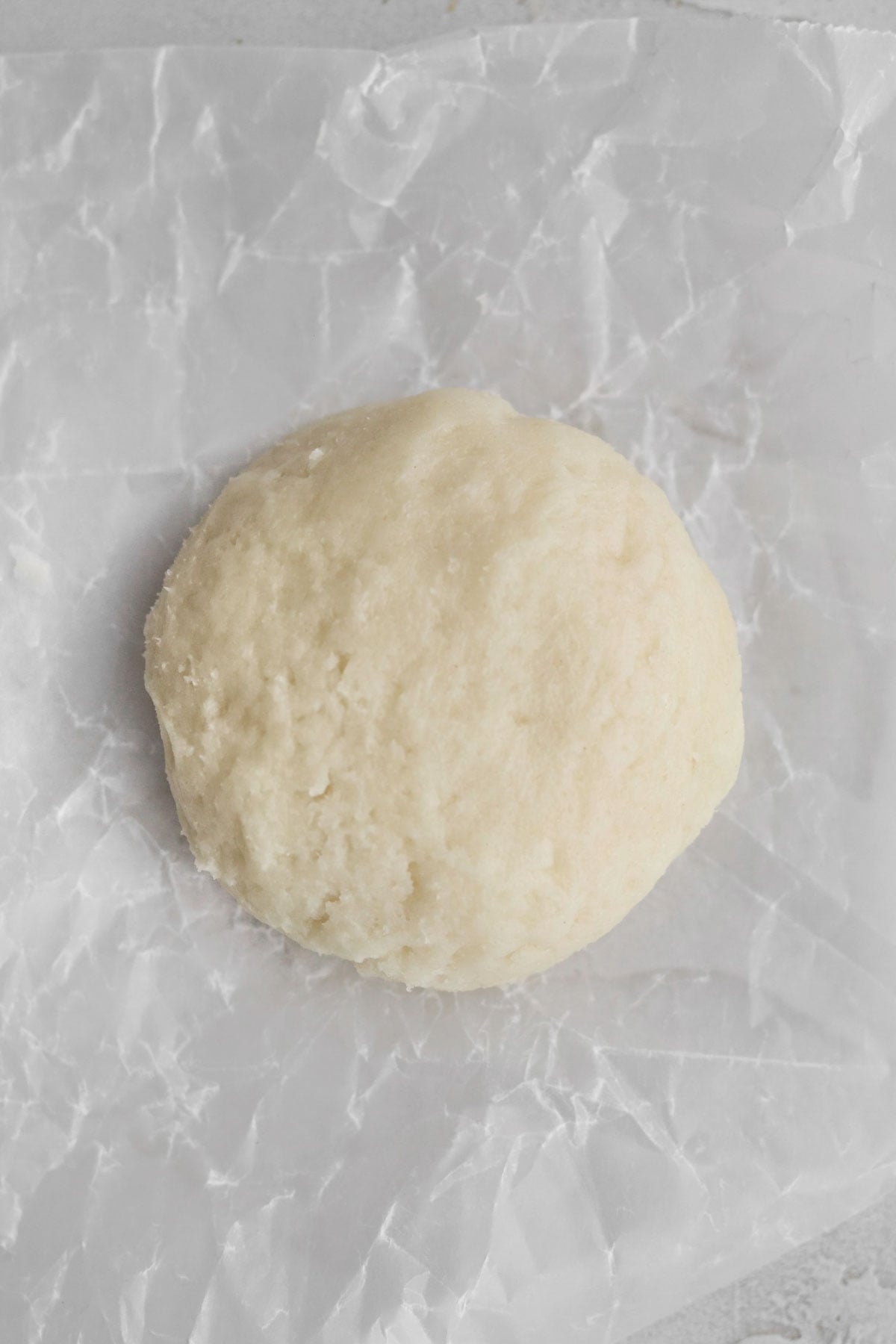 a flattened disc of raspberry cream cheese cookie dough.