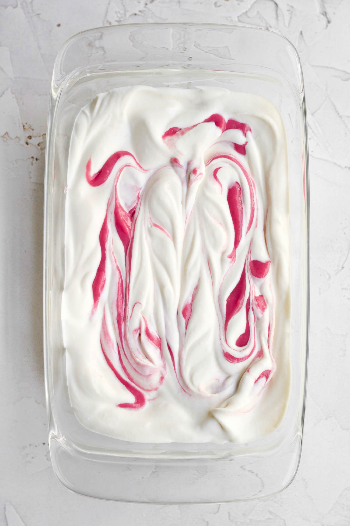 pink raspberry curd swirled into the vanilla ice cream base.