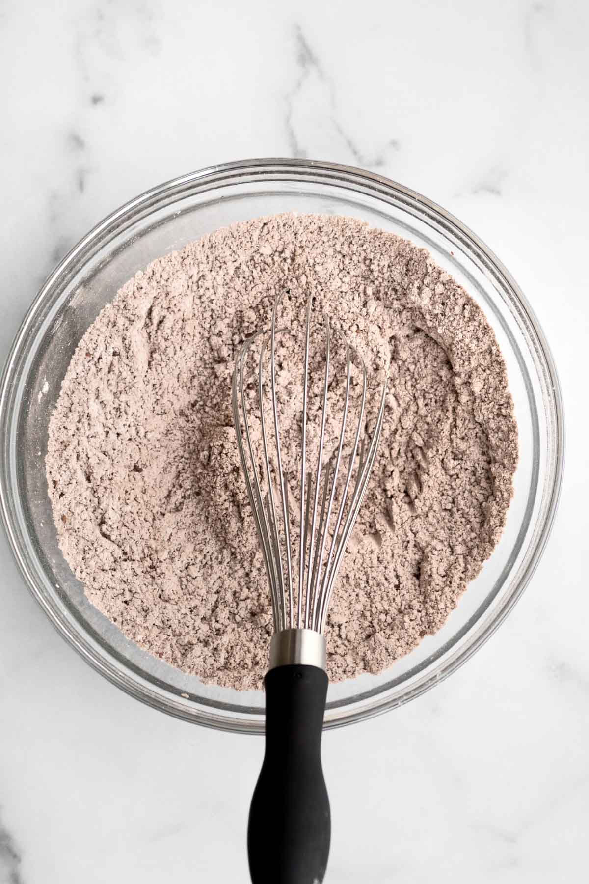 The chocolatey dry ingredients with a whisk.