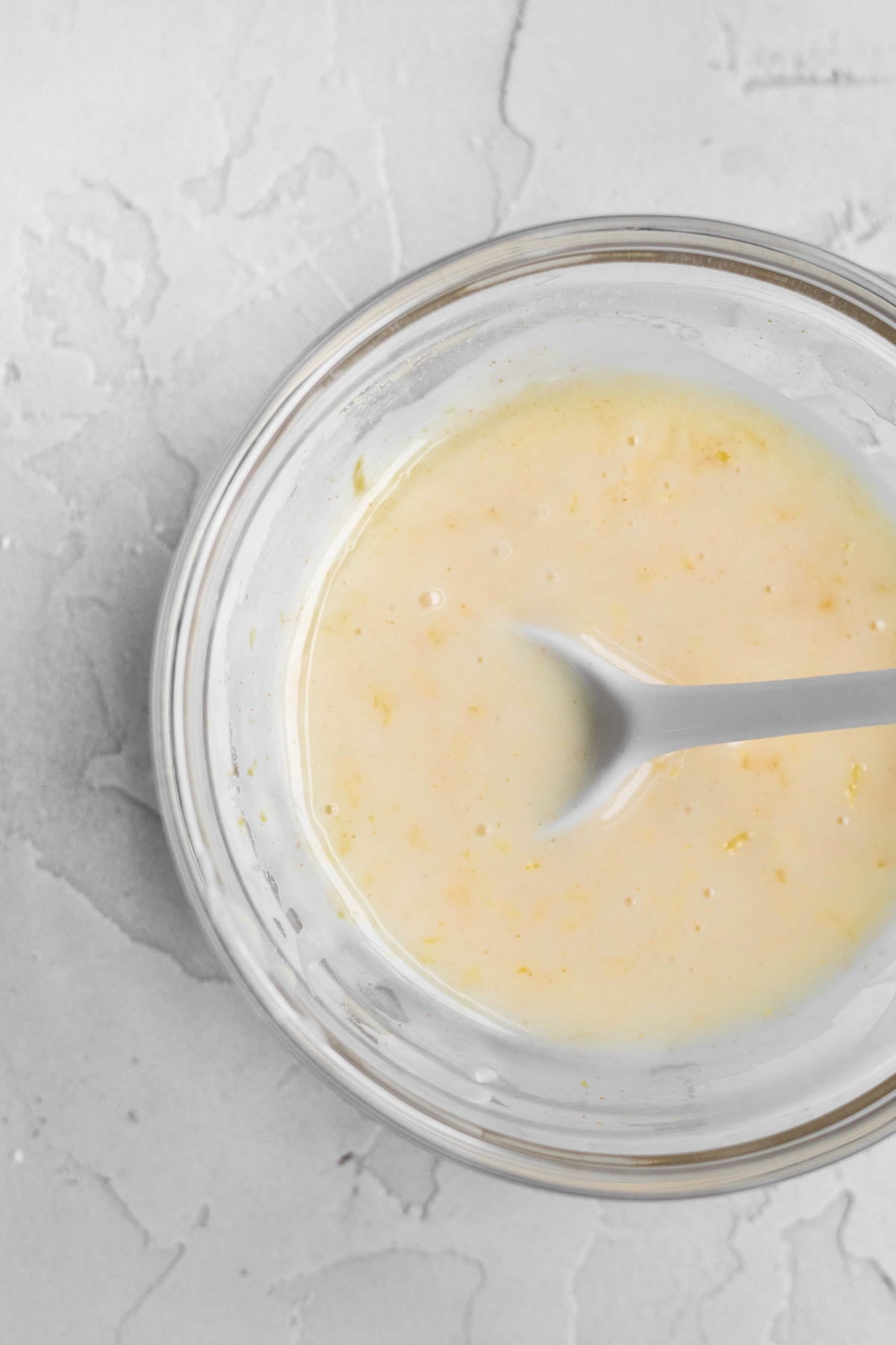 Sugary lemon icing in a bowl.