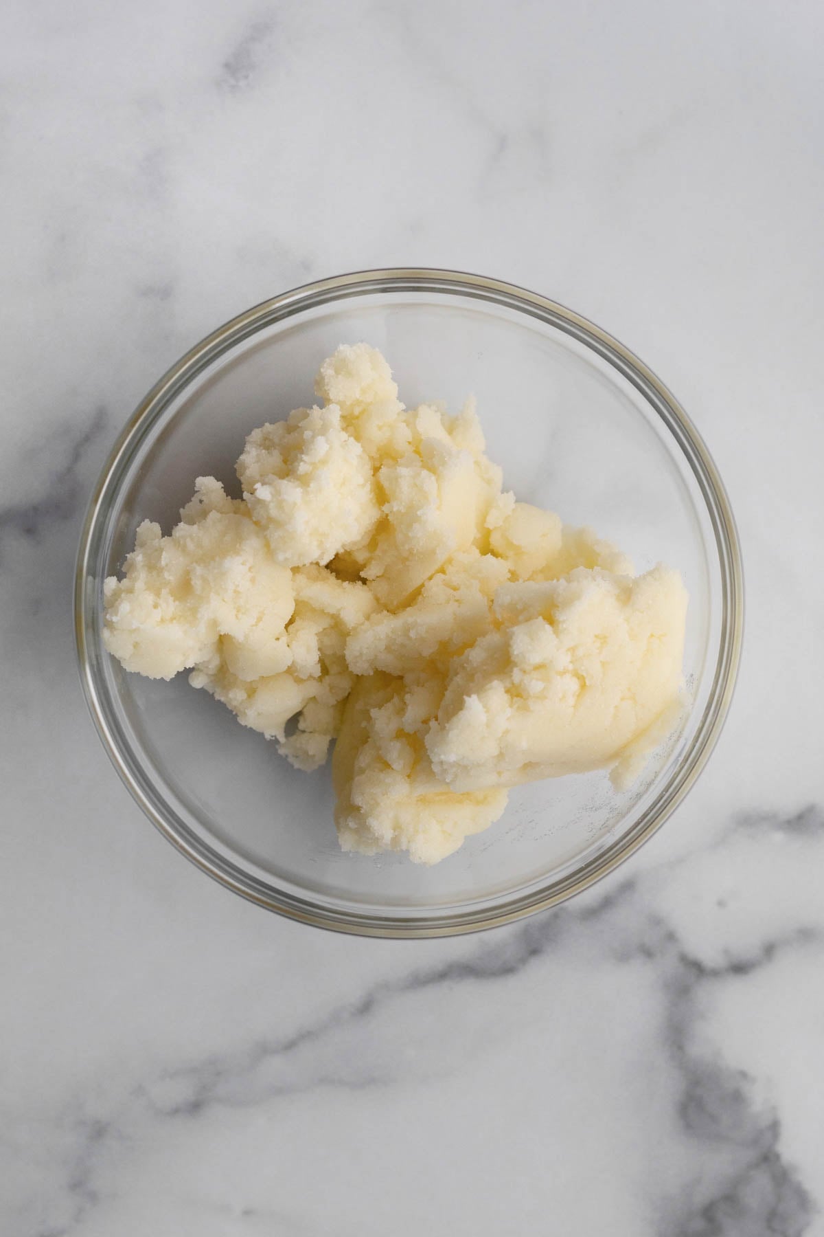Creamed butter and sugar in a bowl.