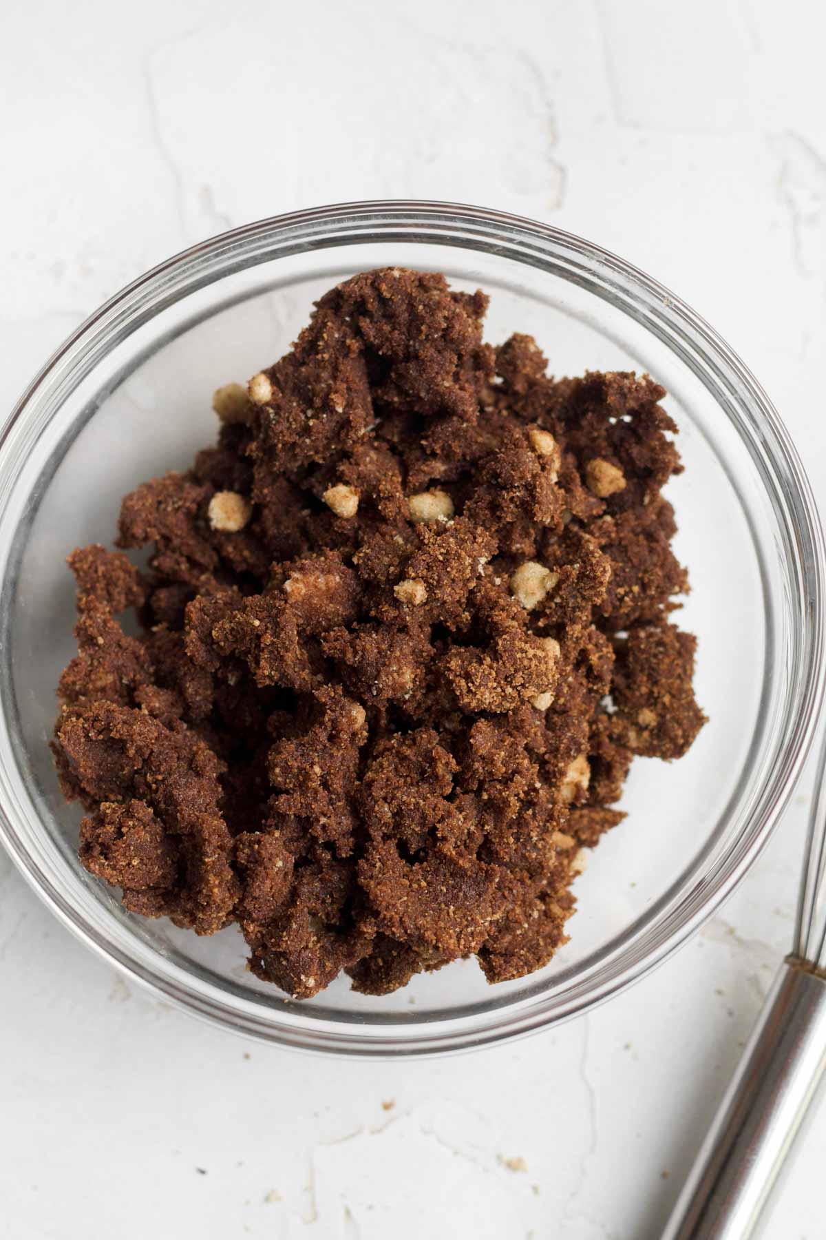 Crumbly chocolate cinnamon sugar filling in a bowl.