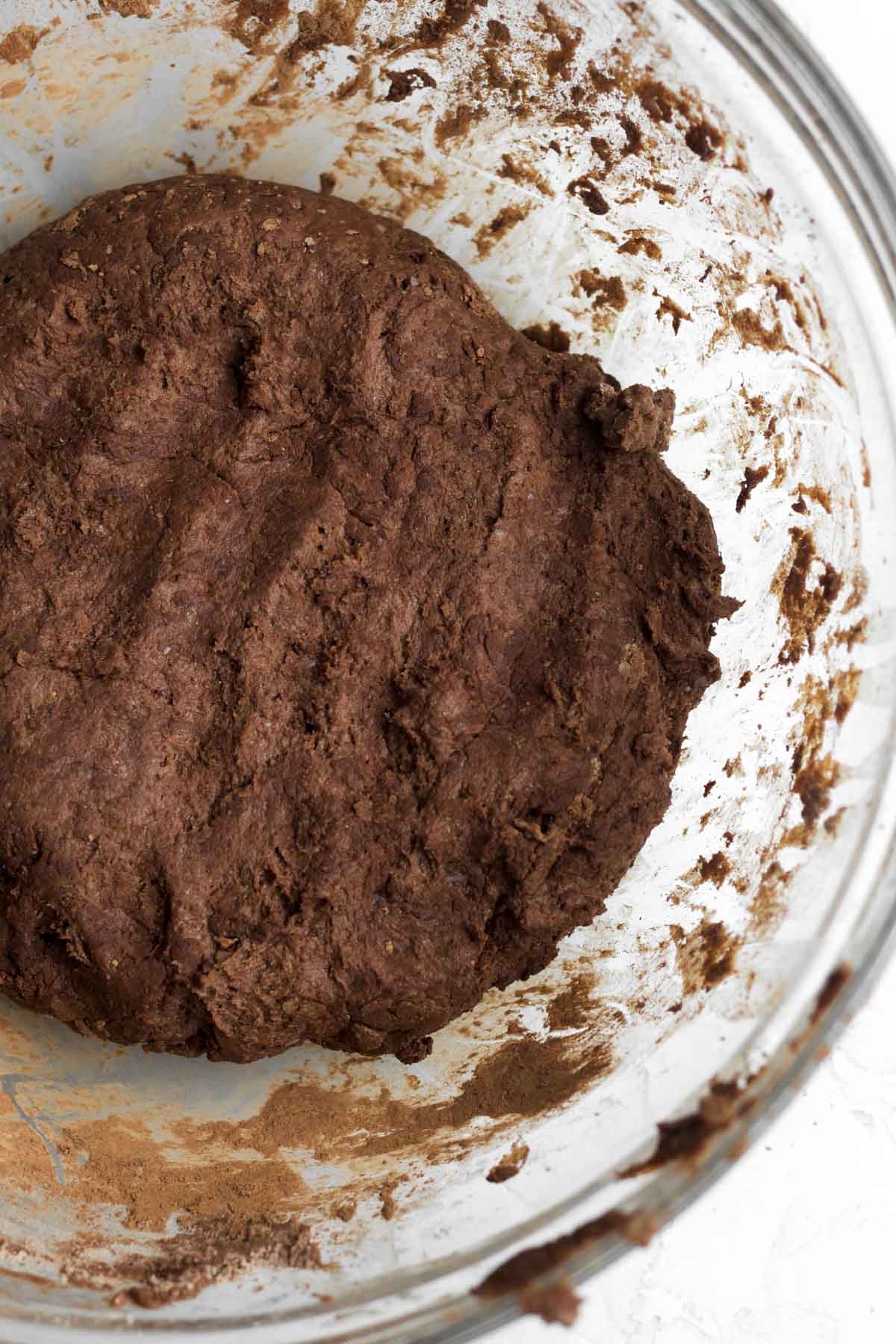 Mixing butter and milk to make a chocolate cinnamon roll batter.