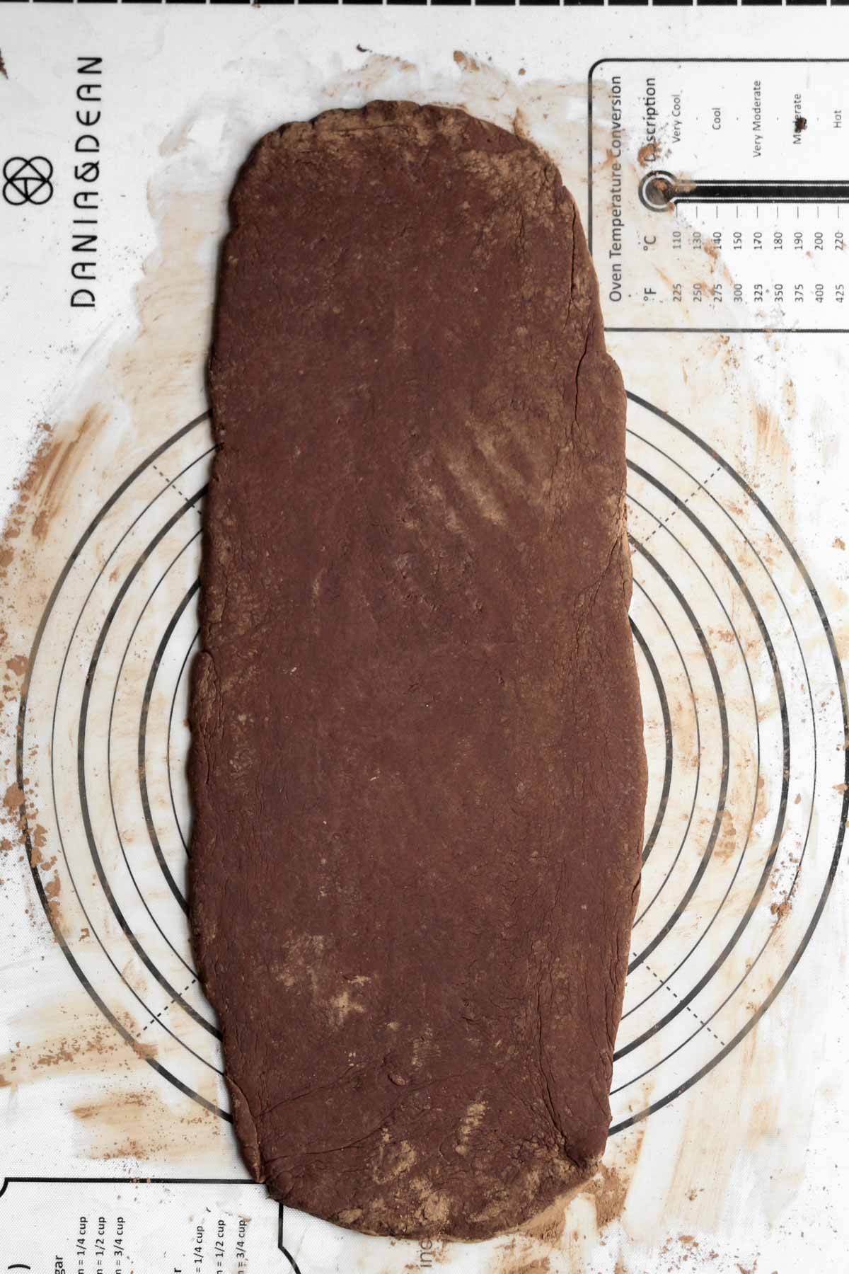 Flattening out the dough into a rectangle.