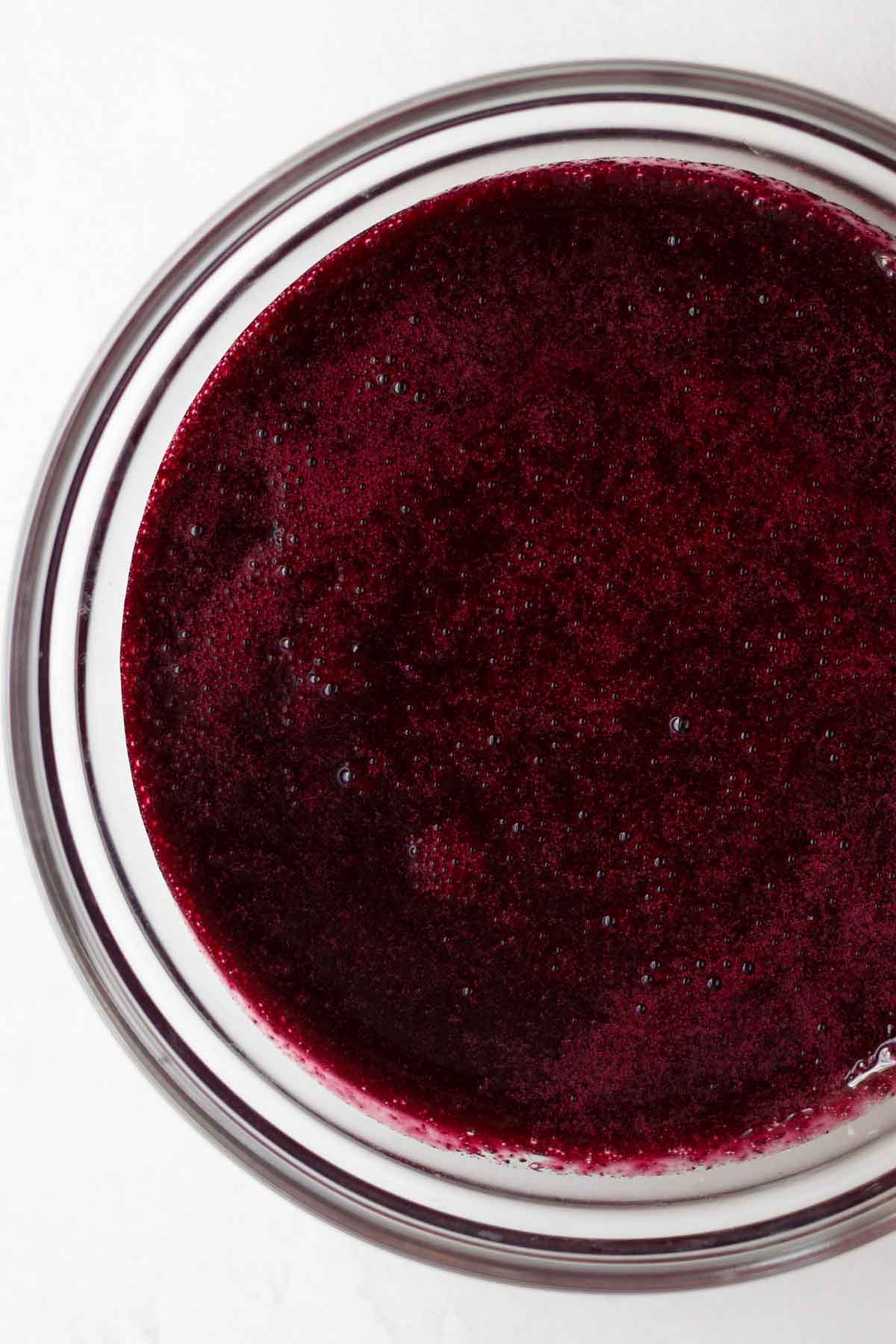 Magenta blueberry liquid blended and strained smooth.