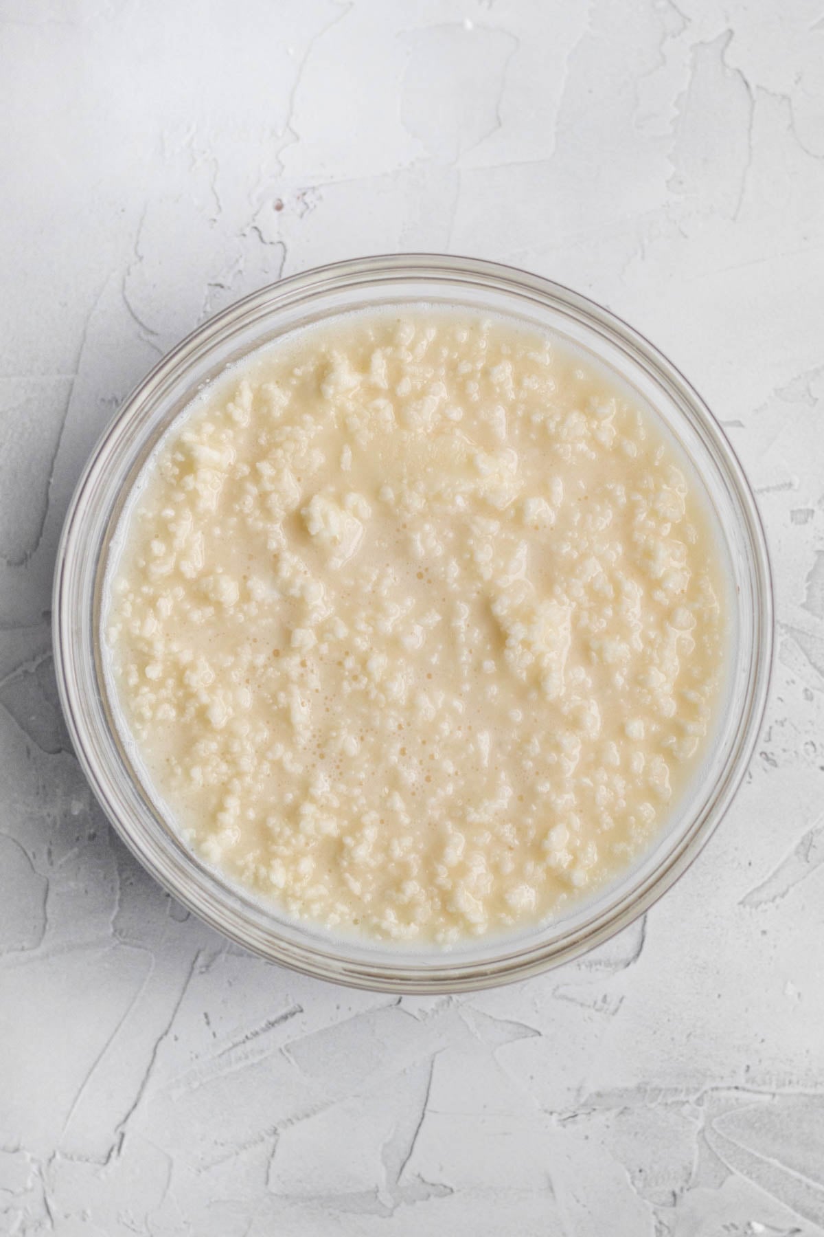 Mixing the wet ingredients into the butter.